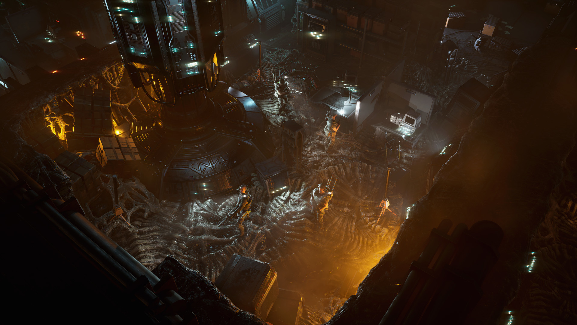 A squad crosses an industrial chamber strewn with alien remains.