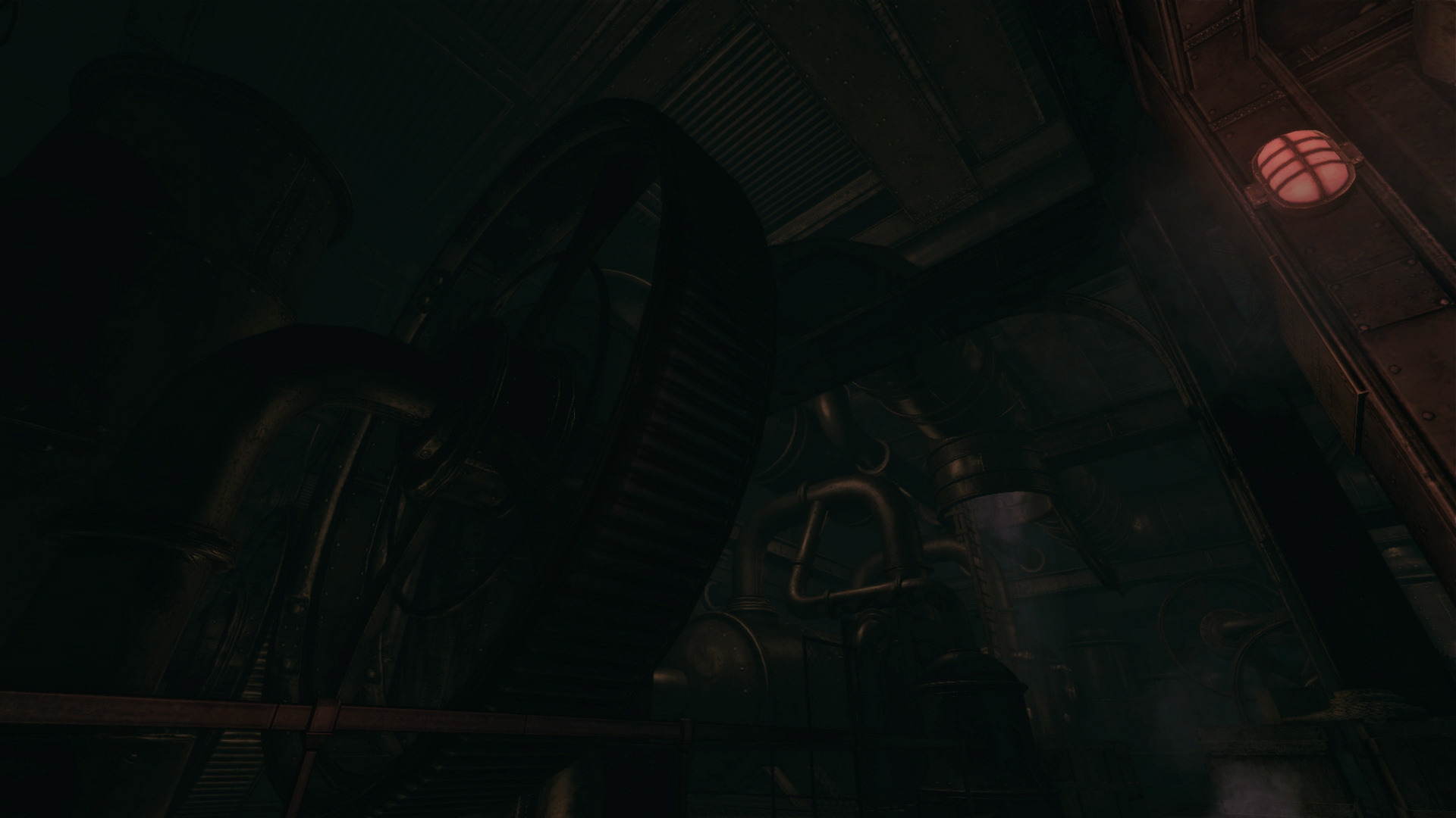 Large machinery rises inside a dark industrial chamber.