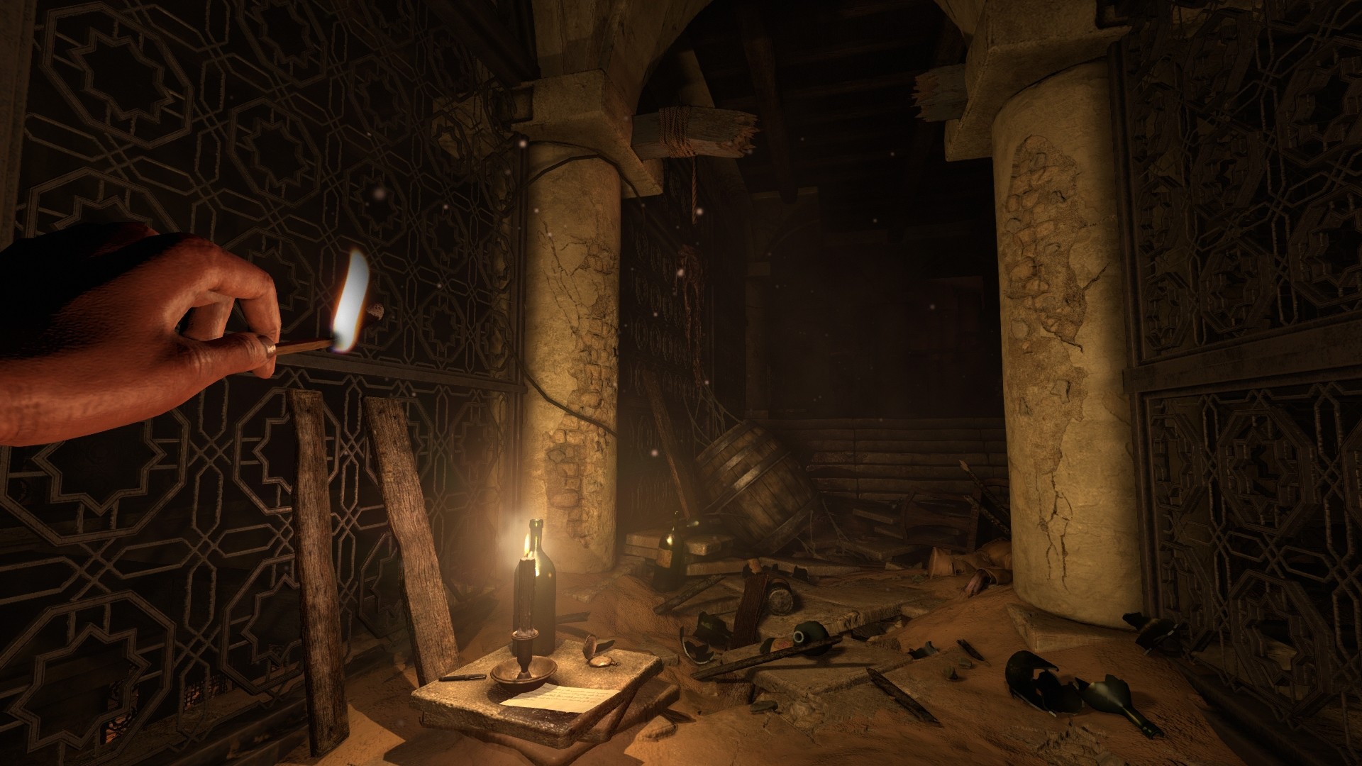 A hand holds a match beside supplies in a desert ruin.