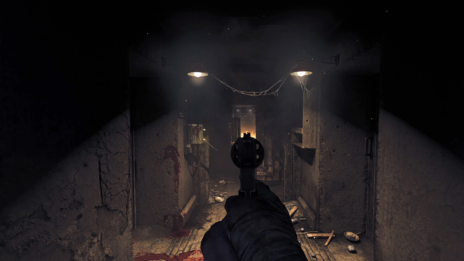 A pistol points down a narrow bunker passage.