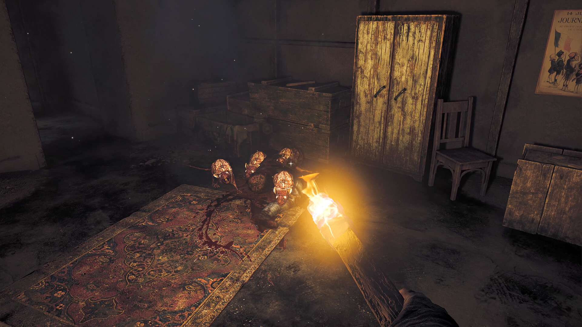 A torch lights a dim room cluttered with crates.