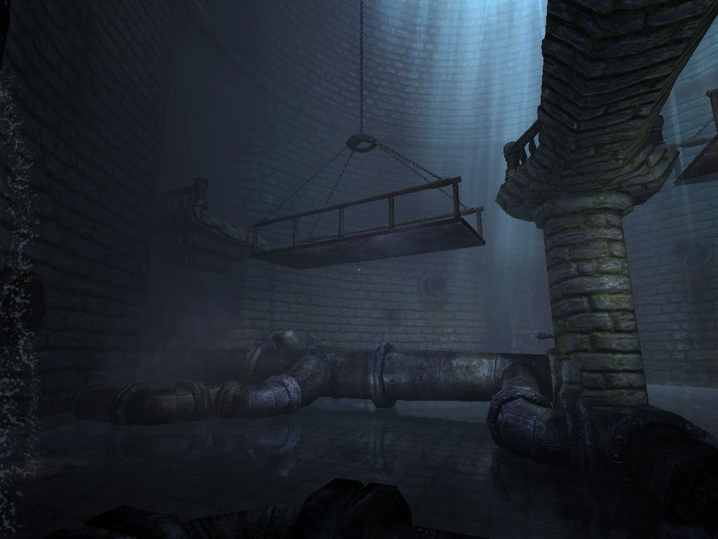 A dim industrial chamber is filled with pipes and machinery.