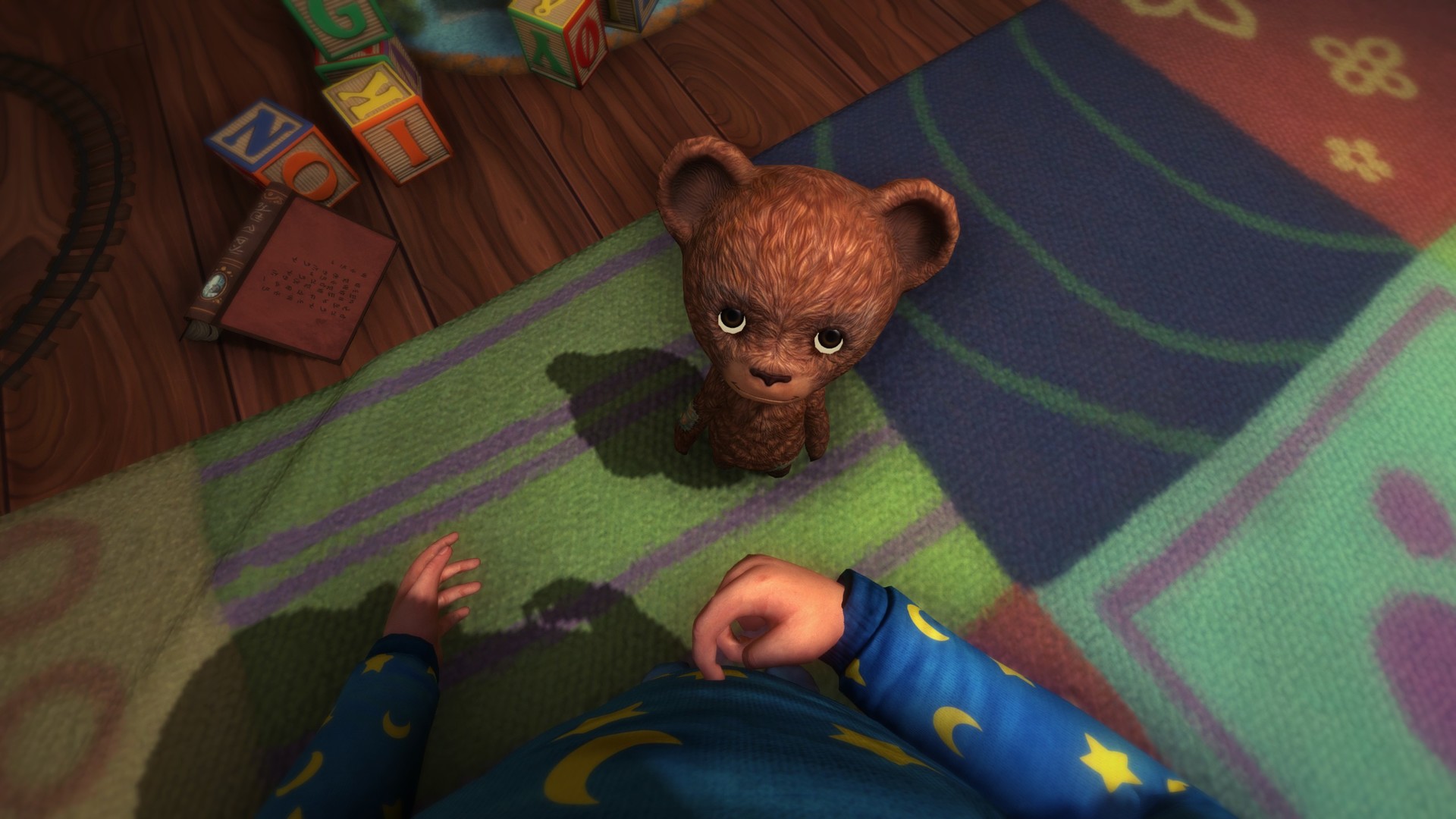 A child reaches toward a small teddy bear on the floor.