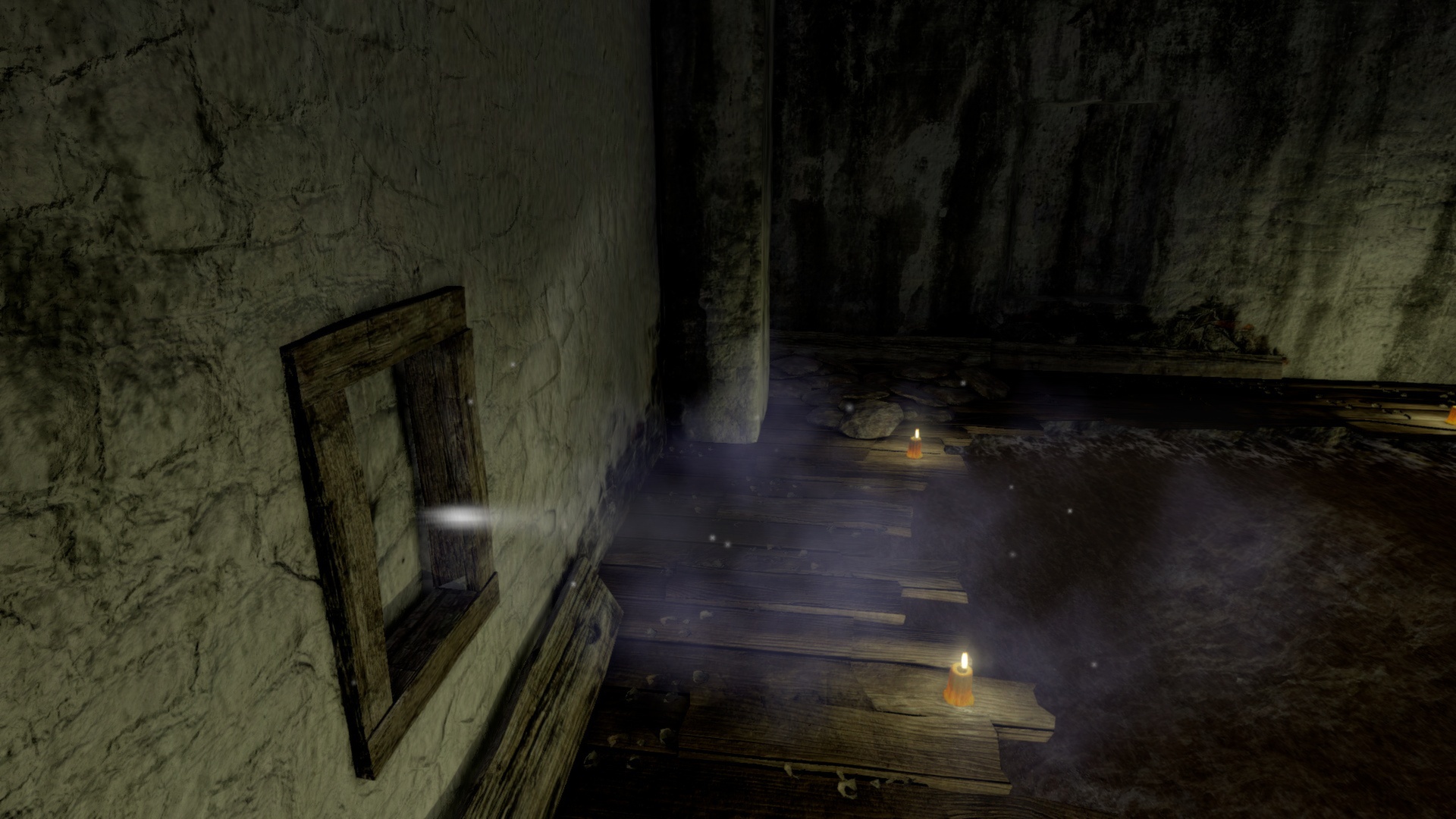 A dim room contains scattered lights and a hanging picture.