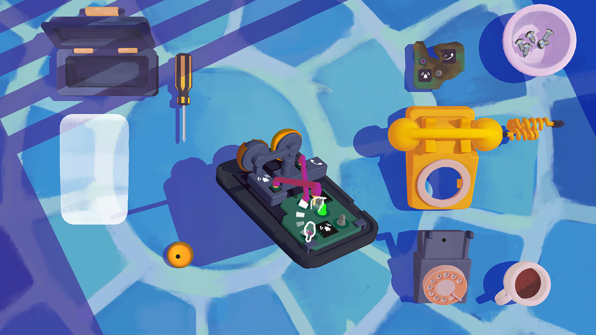 An opened telephone and its components sit on a blue work surface.
