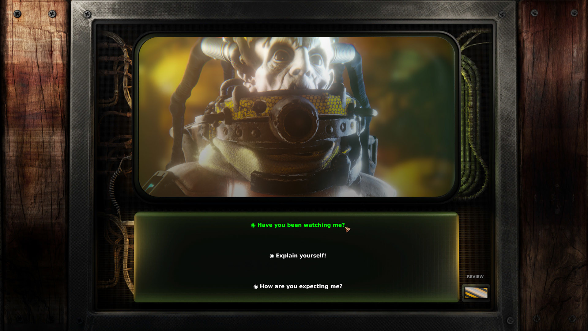 A dialogue scene appears on an old television screen.