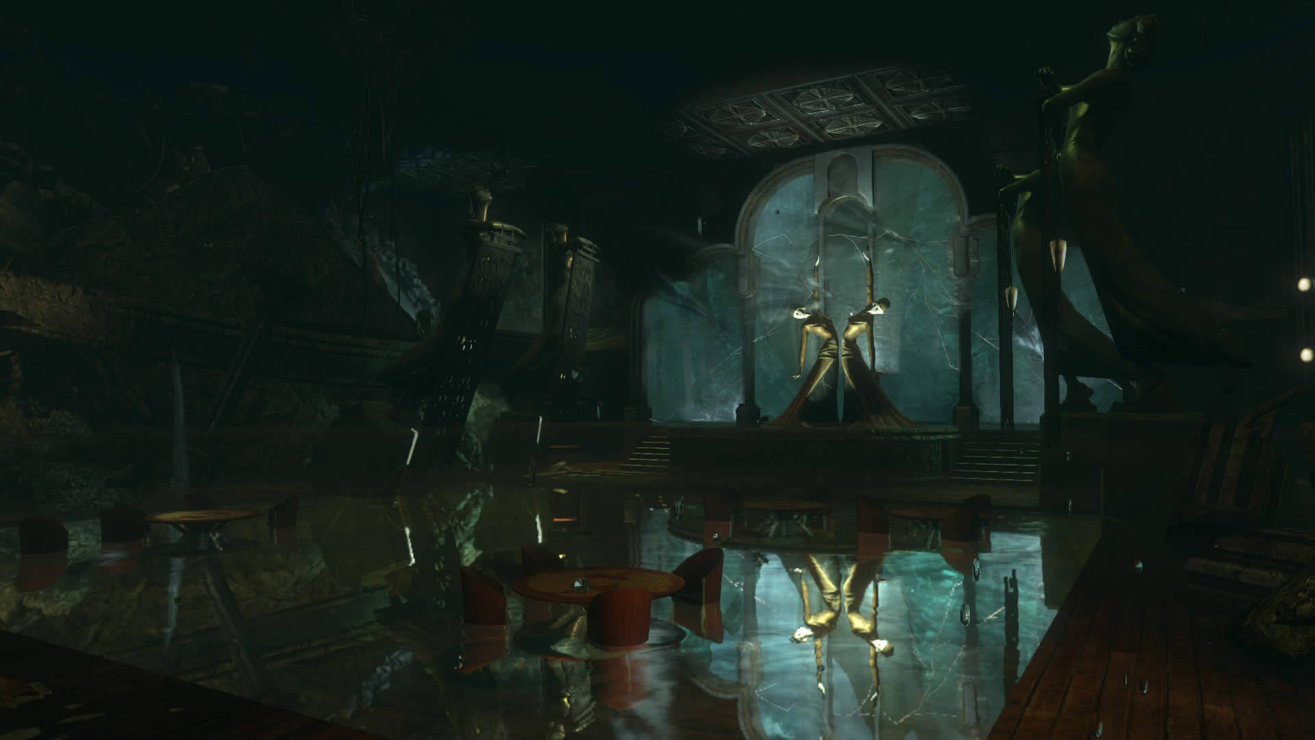 A flooded hall holds statues and a central staircase.