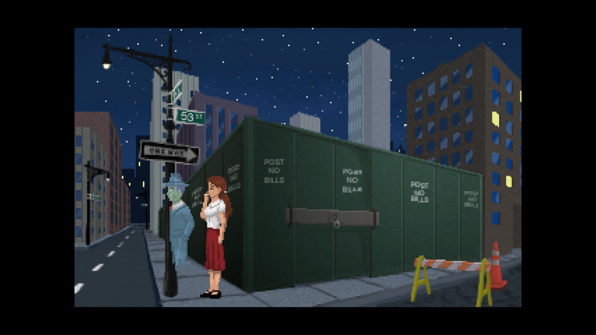 Lauren and Joey stand at a nighttime street corner beside construction fencing.