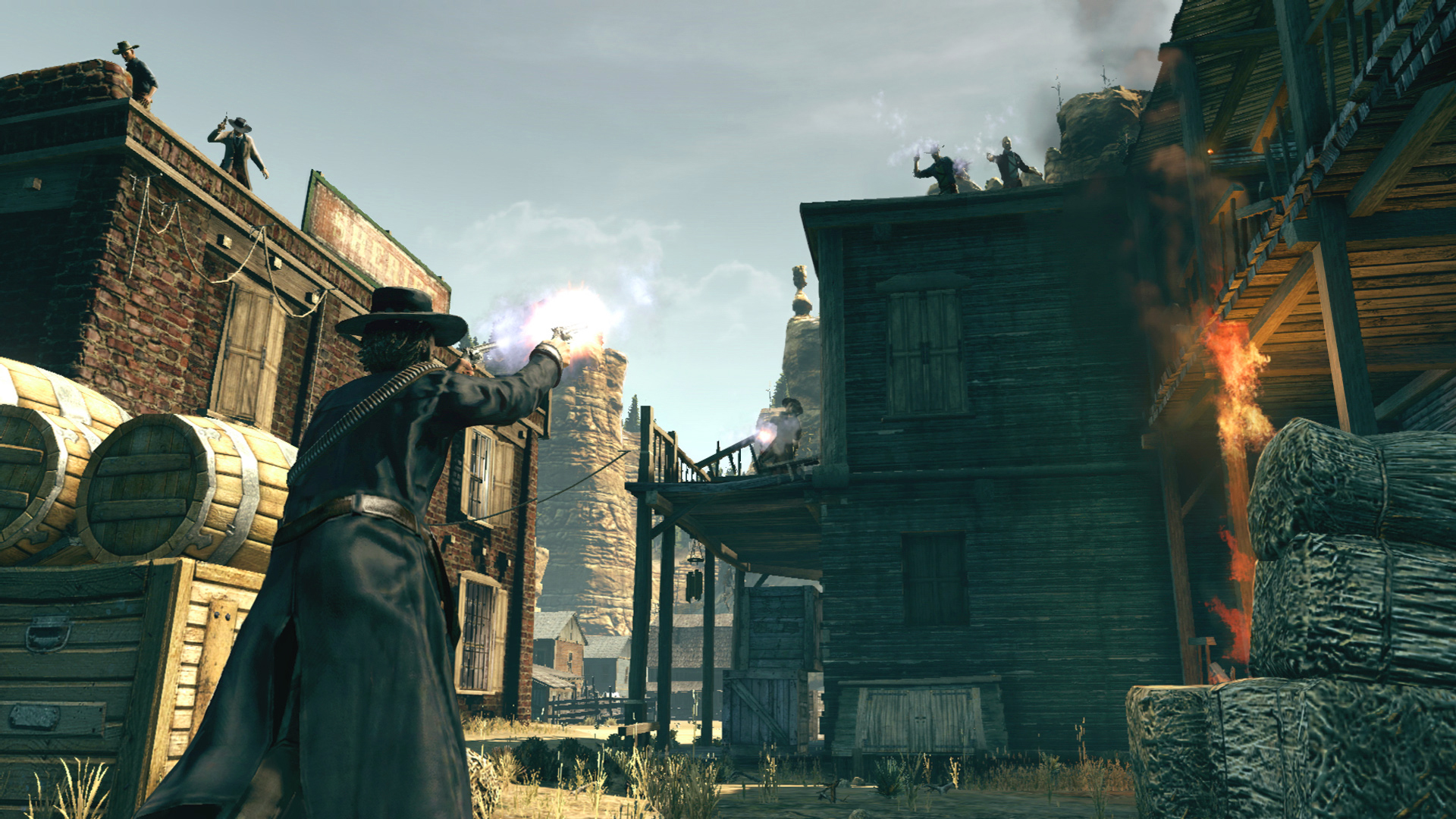 A gunfighter fires toward enemies on the roofs of a Western town.