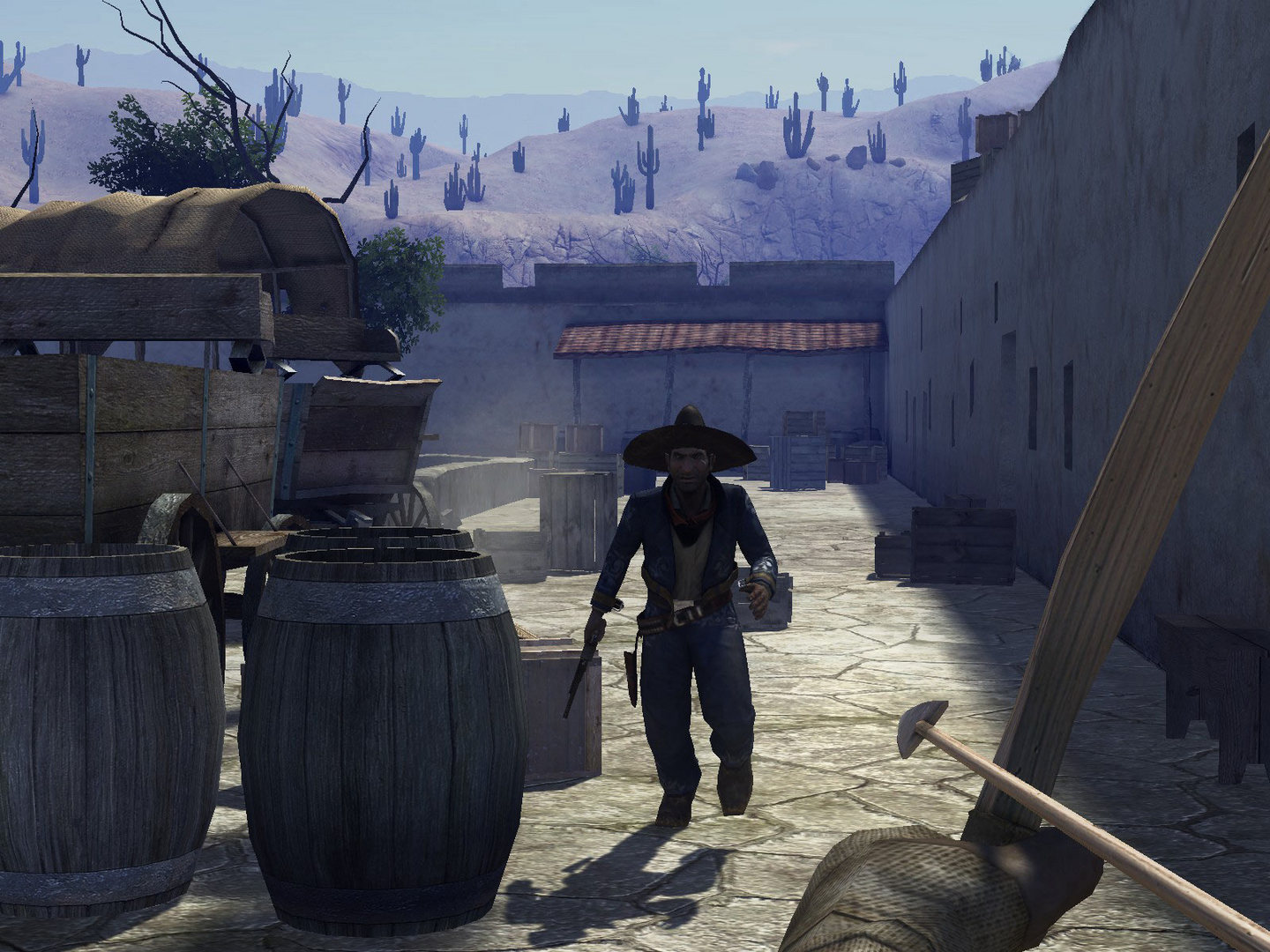 A gunfighter approaches through a sunlit yard lined with barrels.