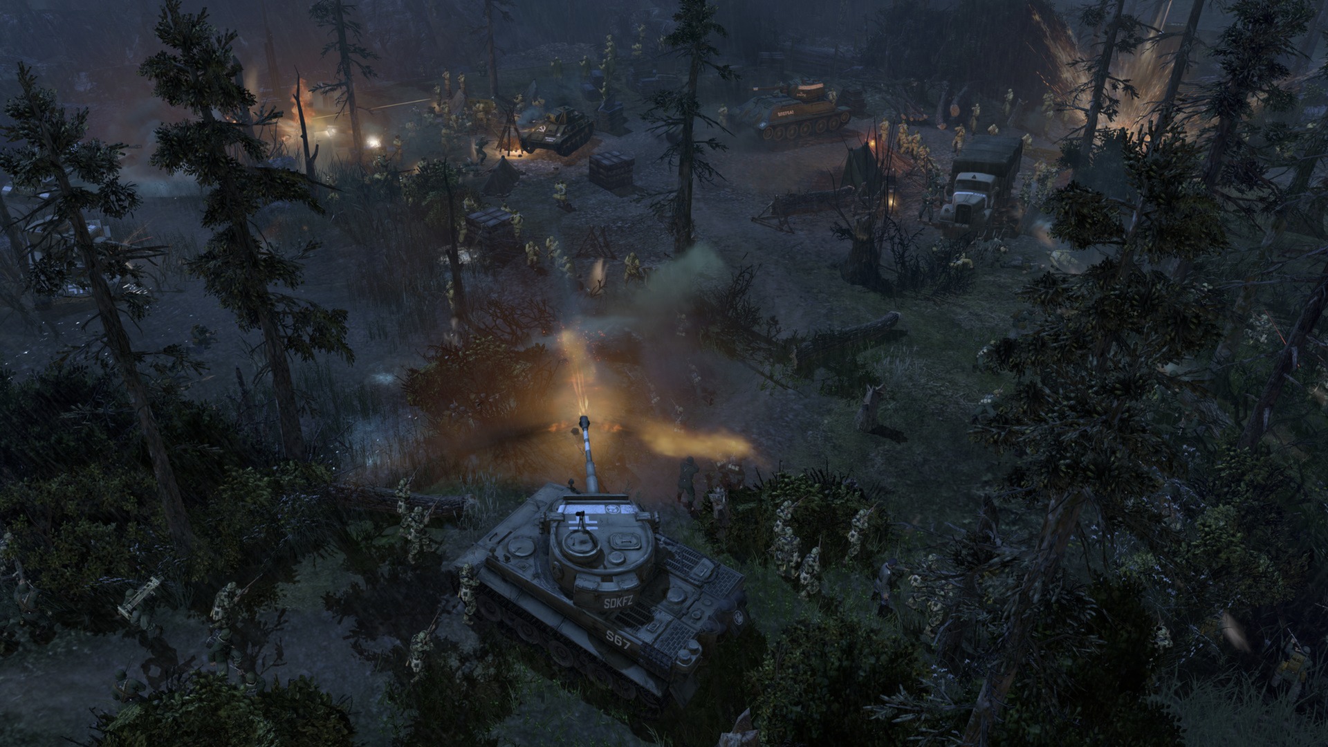 Armoured vehicles advance through a dark wooded area.