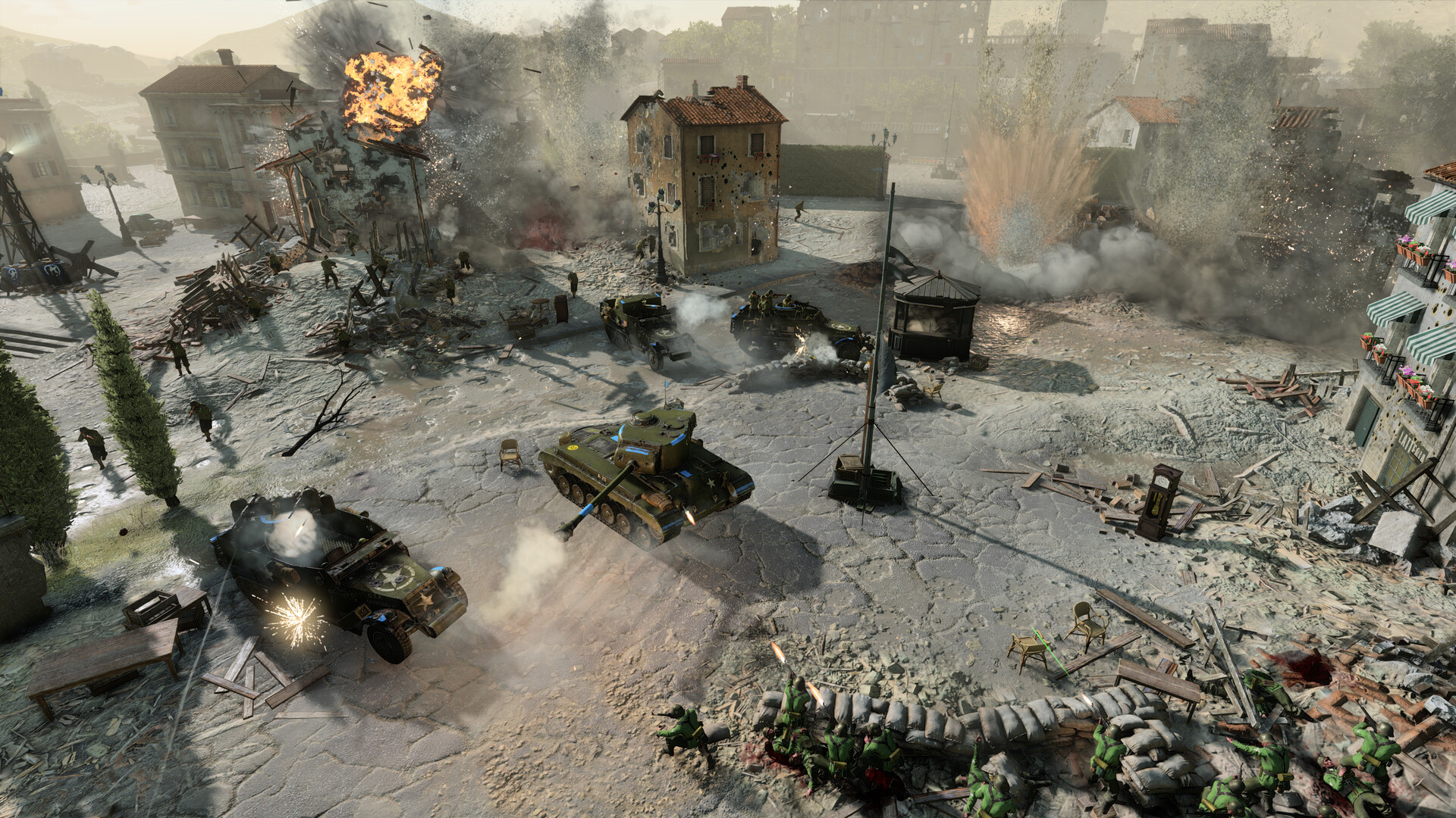 A tank advances through a damaged town square.