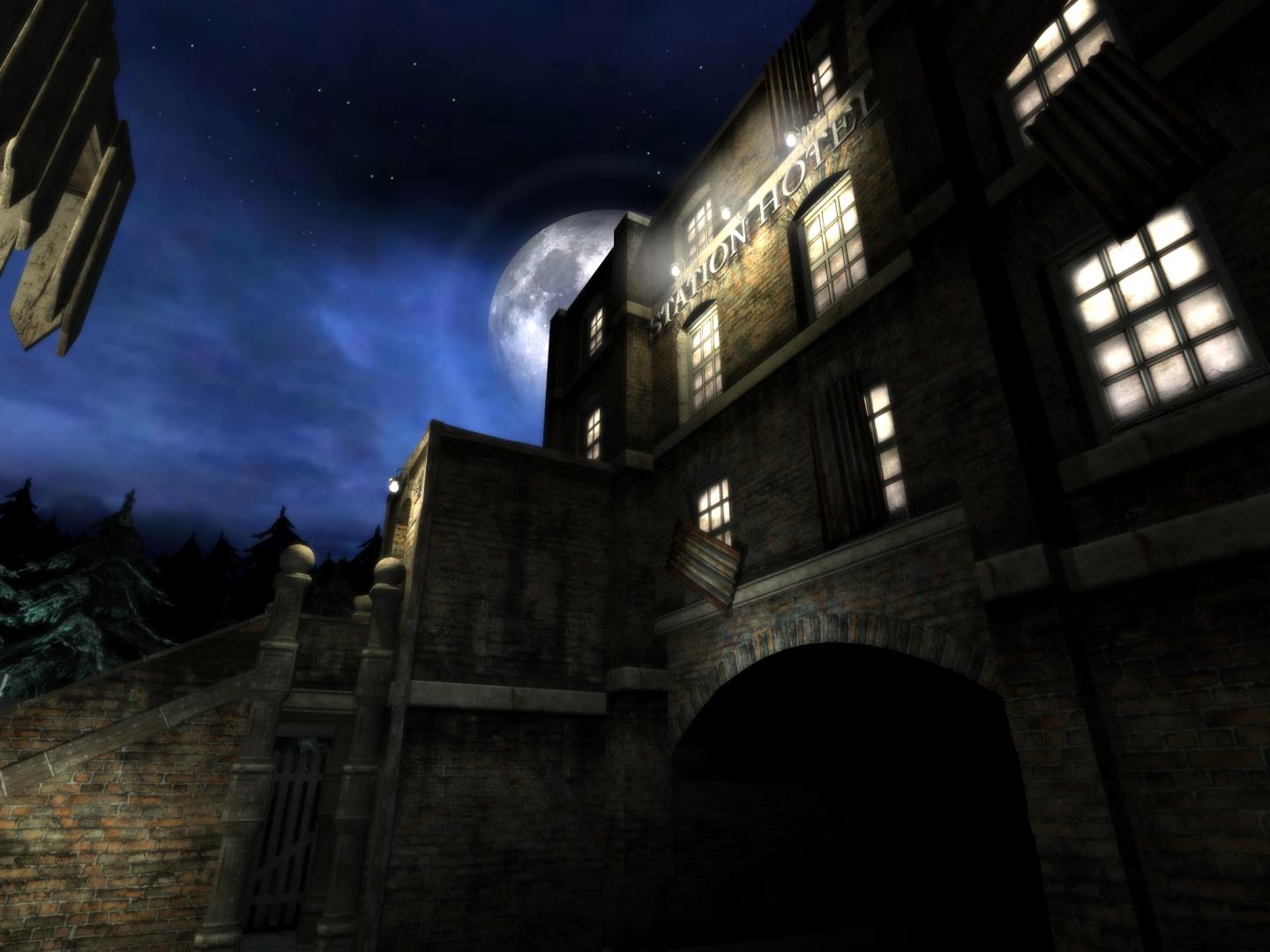 A building stands beneath moonlight at night.