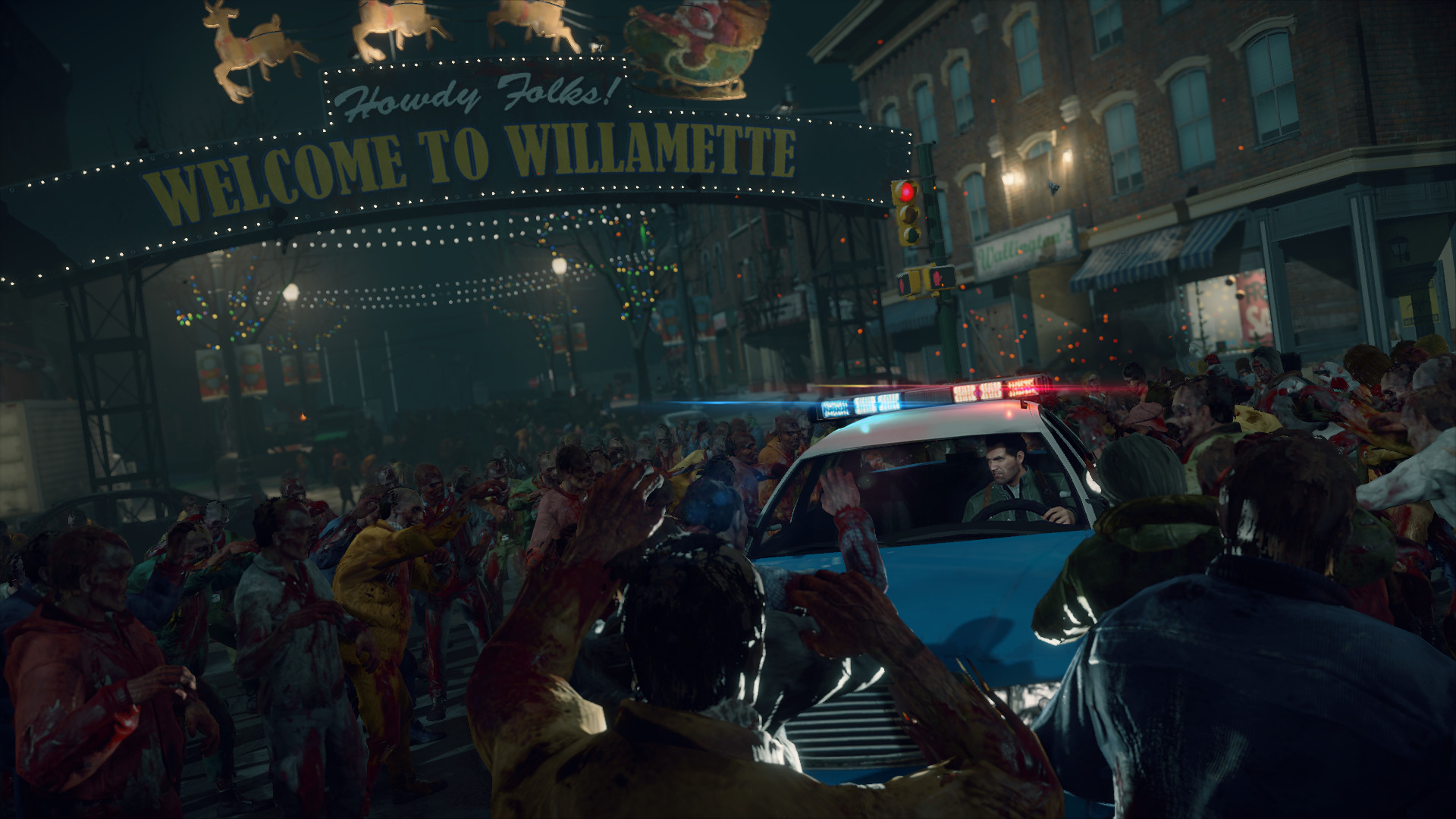 A crowd of zombies fills a street beneath the Willamette sign.