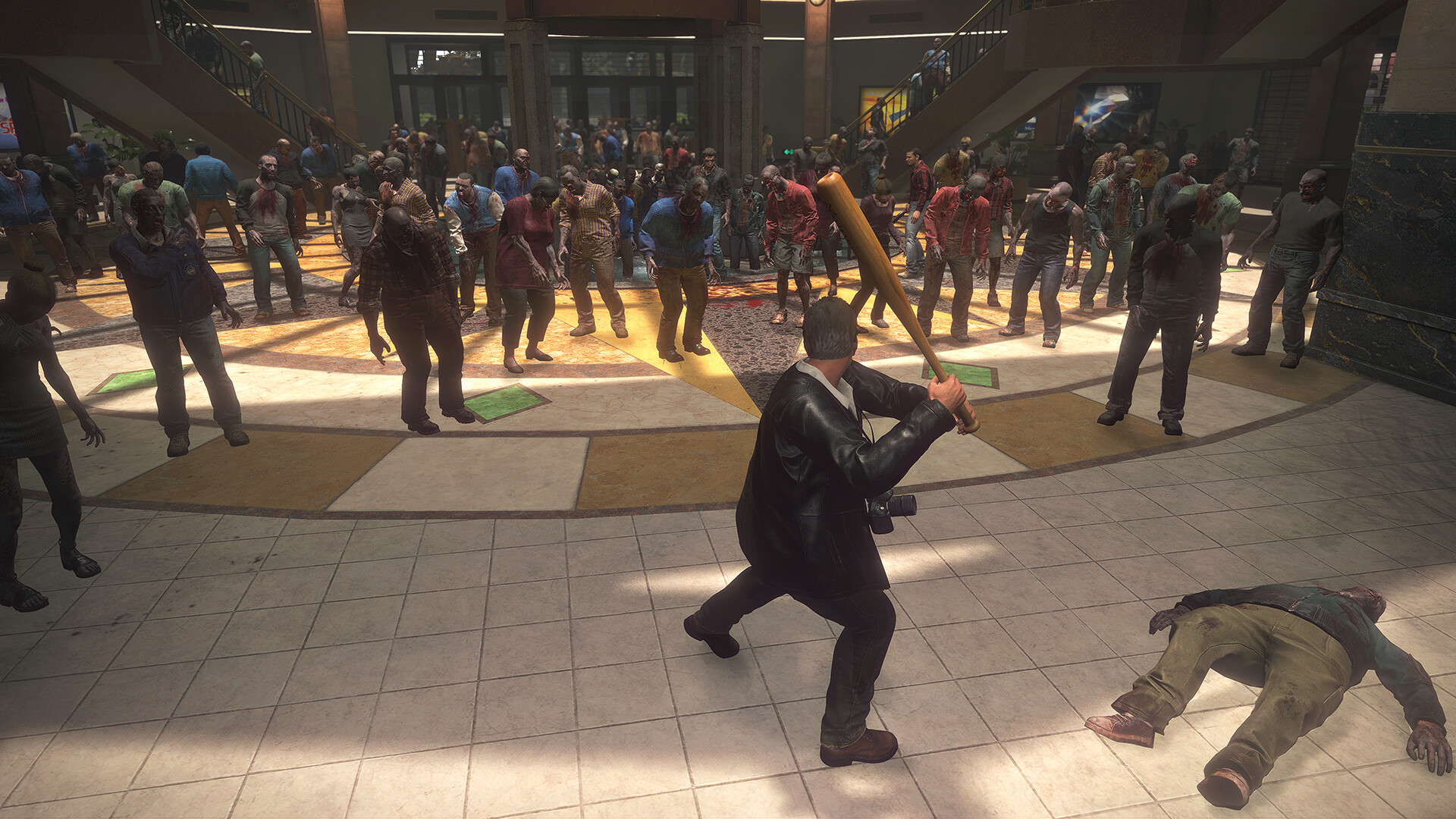 Frank faces a crowd of zombies inside the shopping mall.