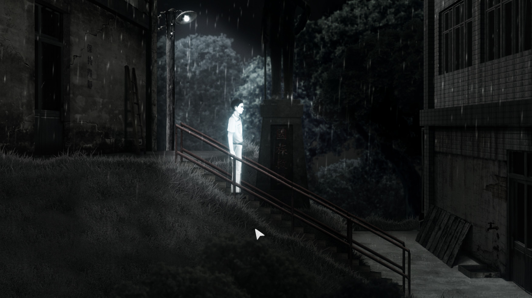 A student stands by a stairway between school buildings at night.