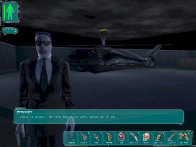 A suited character speaks near a helicopter during a dialogue scene.
