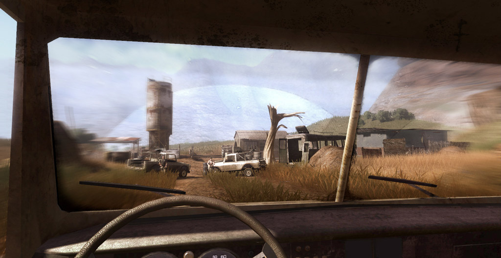 The player drives toward a settlement across a dry landscape.