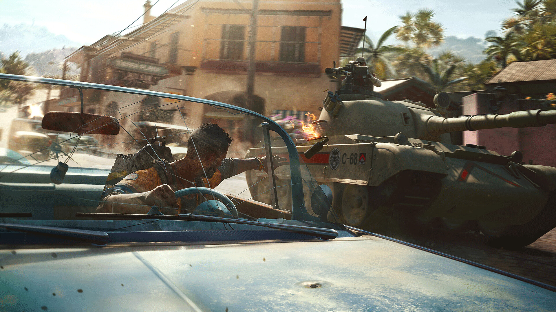 Dani crouches in a vehicle as a tank moves along a Yaran street.