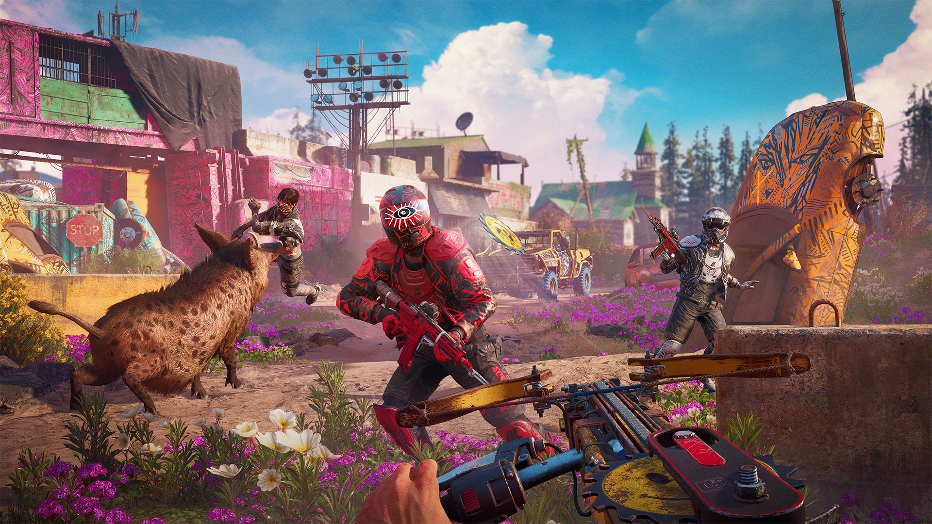 The Highwaymen advance through a colourful Hope County settlement.
