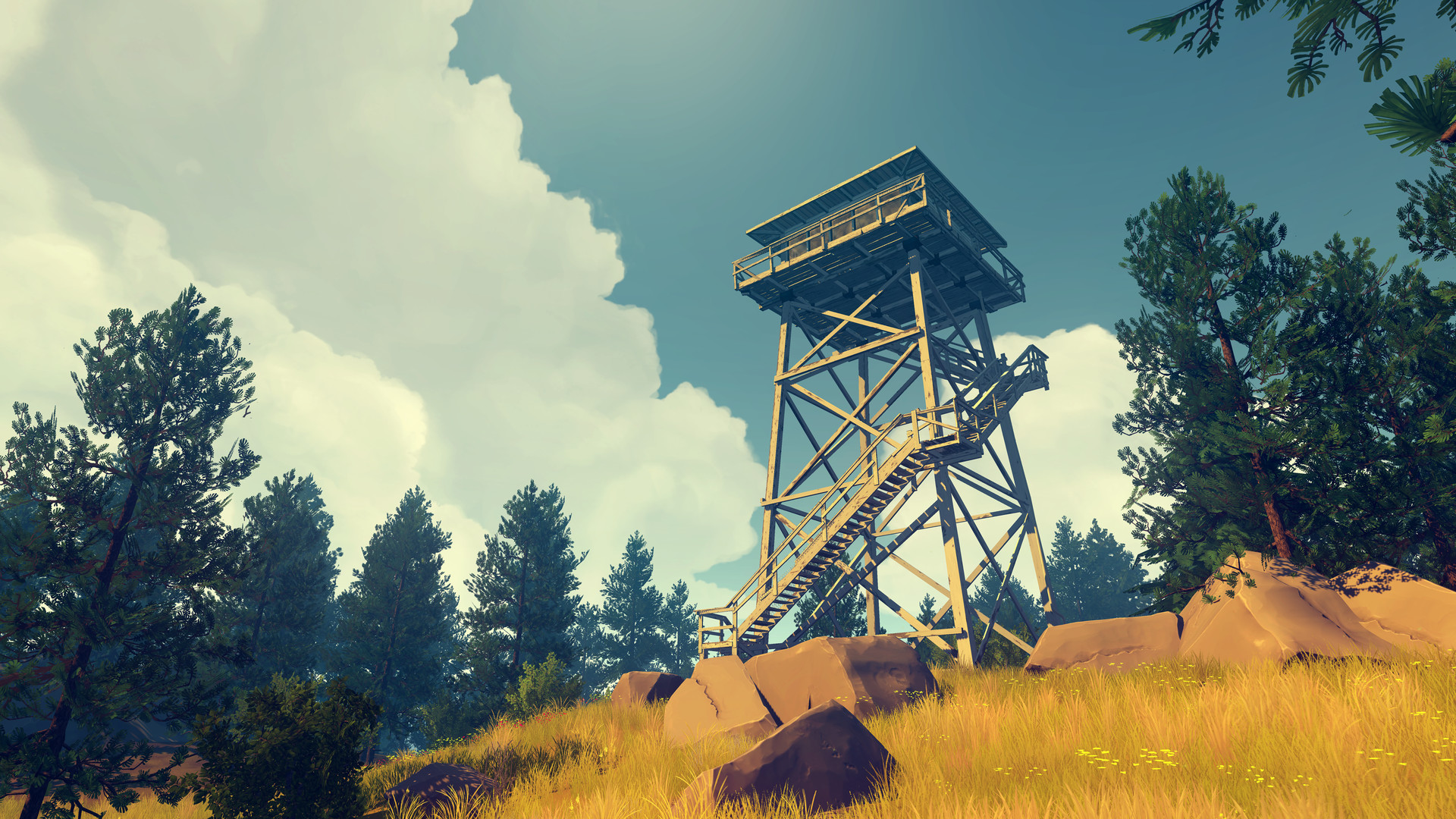 A wooden fire lookout tower rises above the trees.