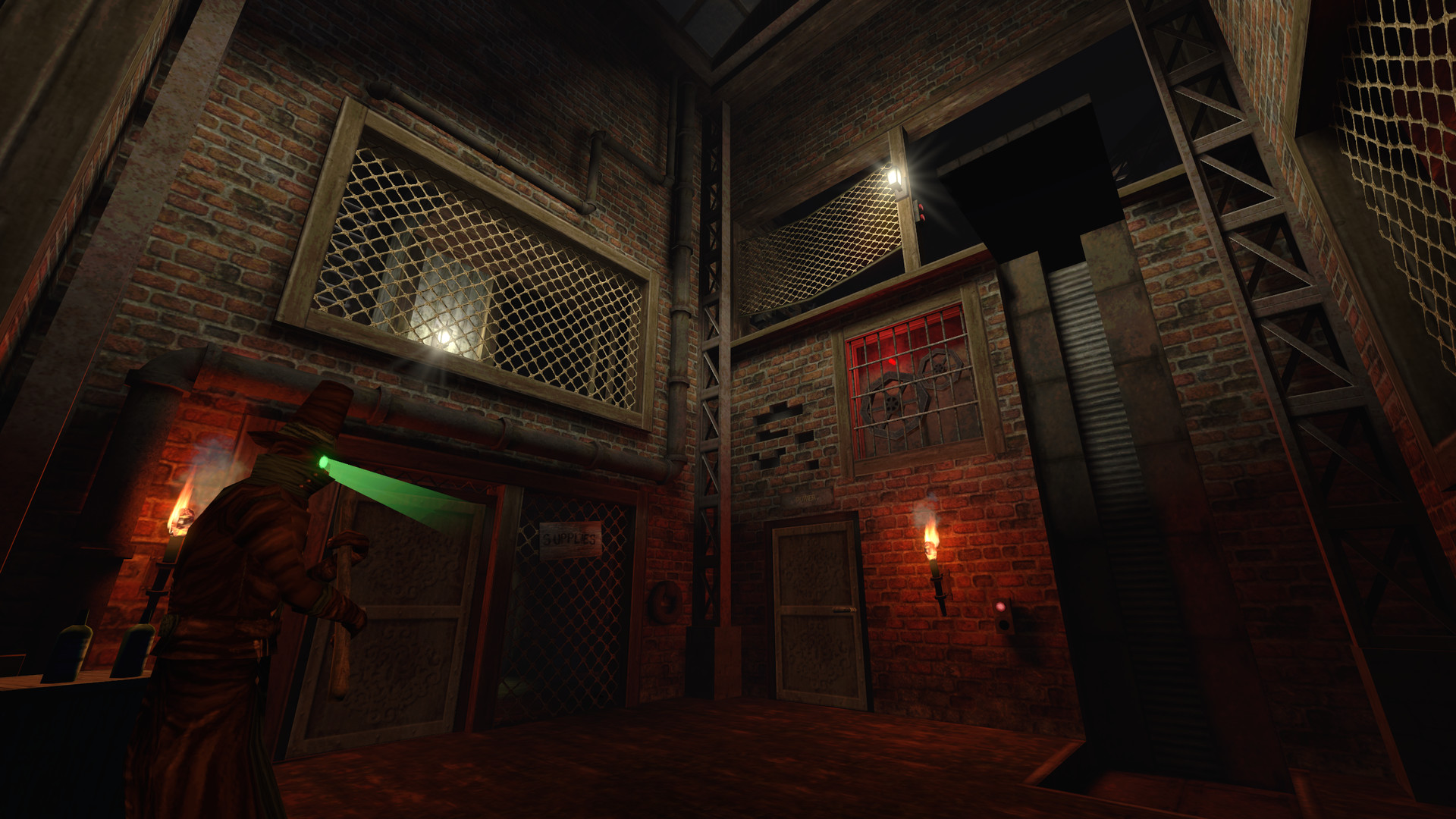A player approaches a brick building while a guard searches with a light.
