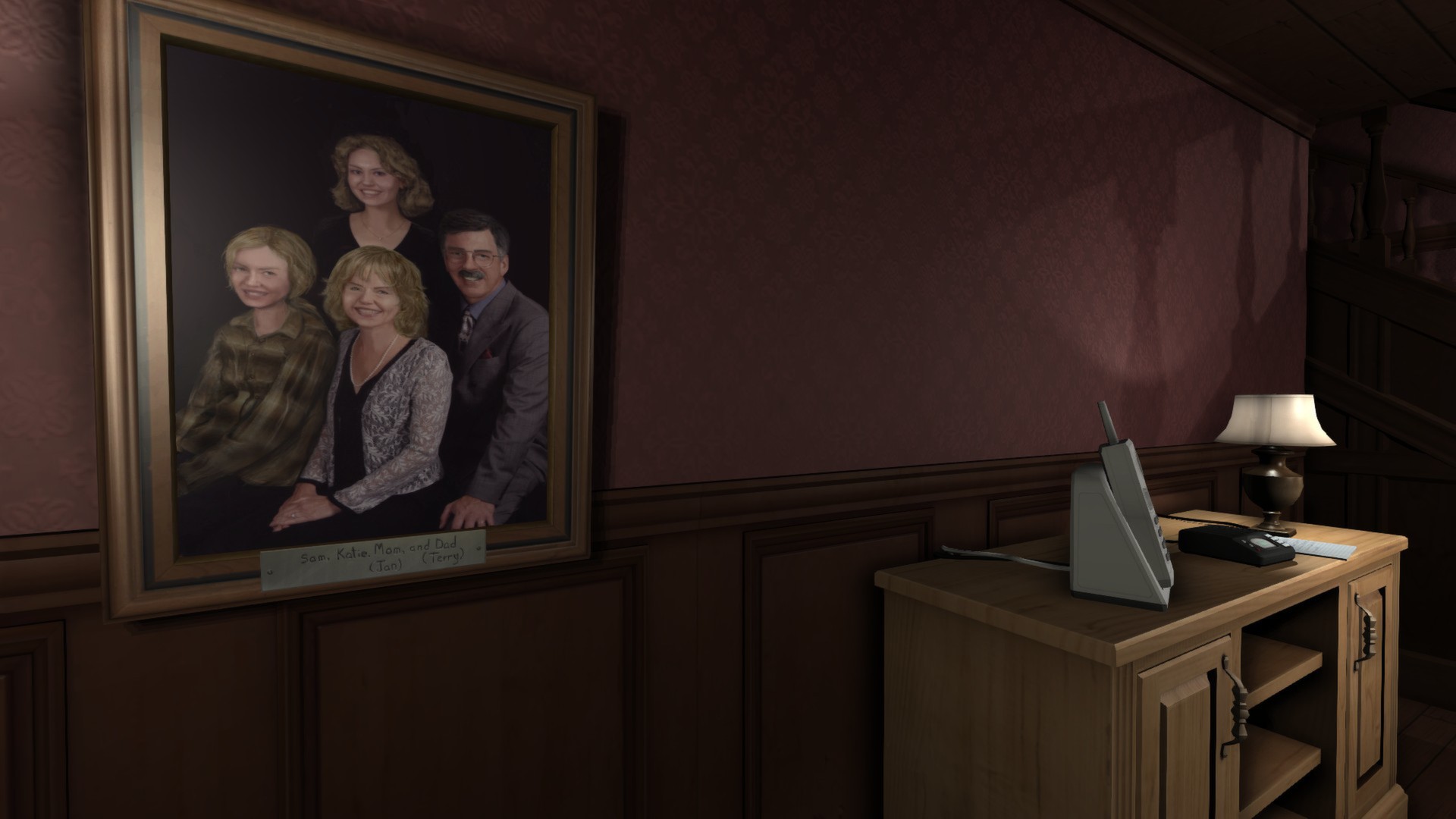 A family portrait hangs above a cabinet in a house.