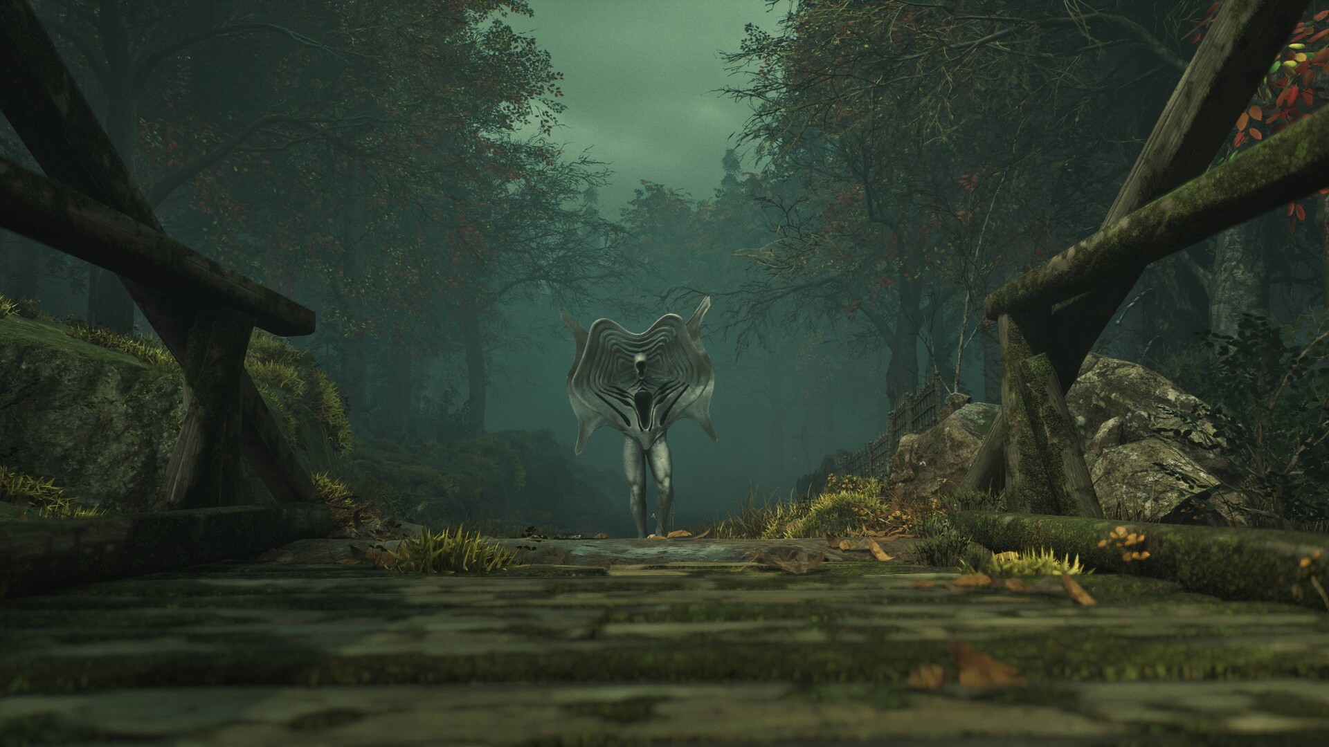 A pale creature stands at the end of a misty woodland path.
