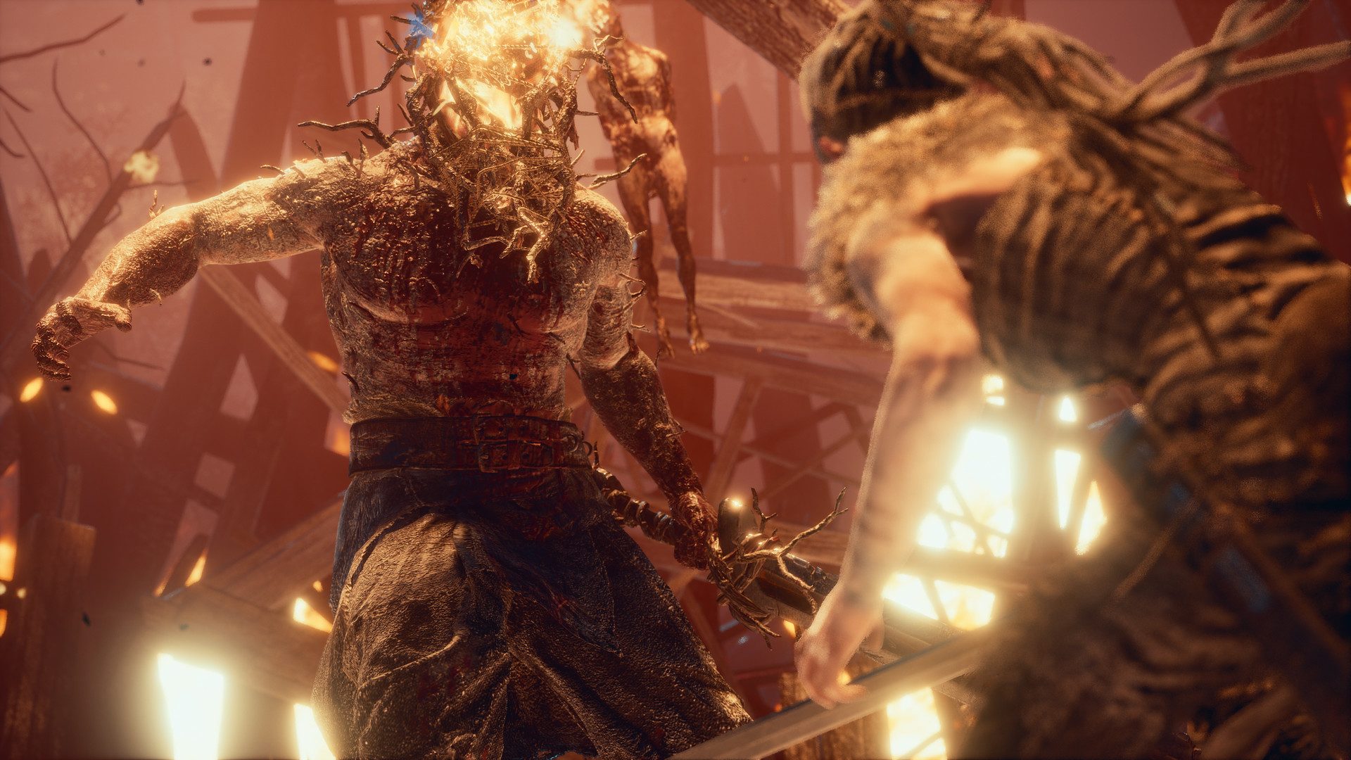 Senua faces a burning opponent with sword raised.