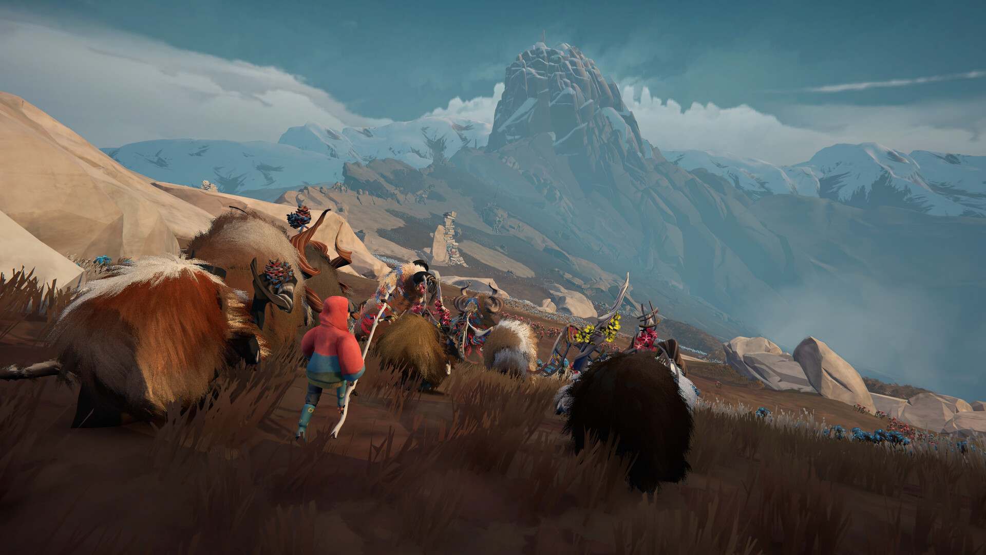 Via guides a group of shaggy Calicorns along a mountain path.