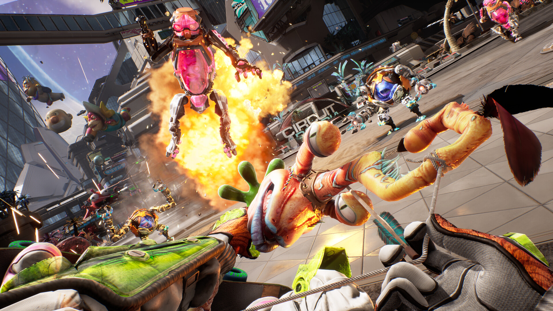A talking weapon faces alien enemies amid an explosion.