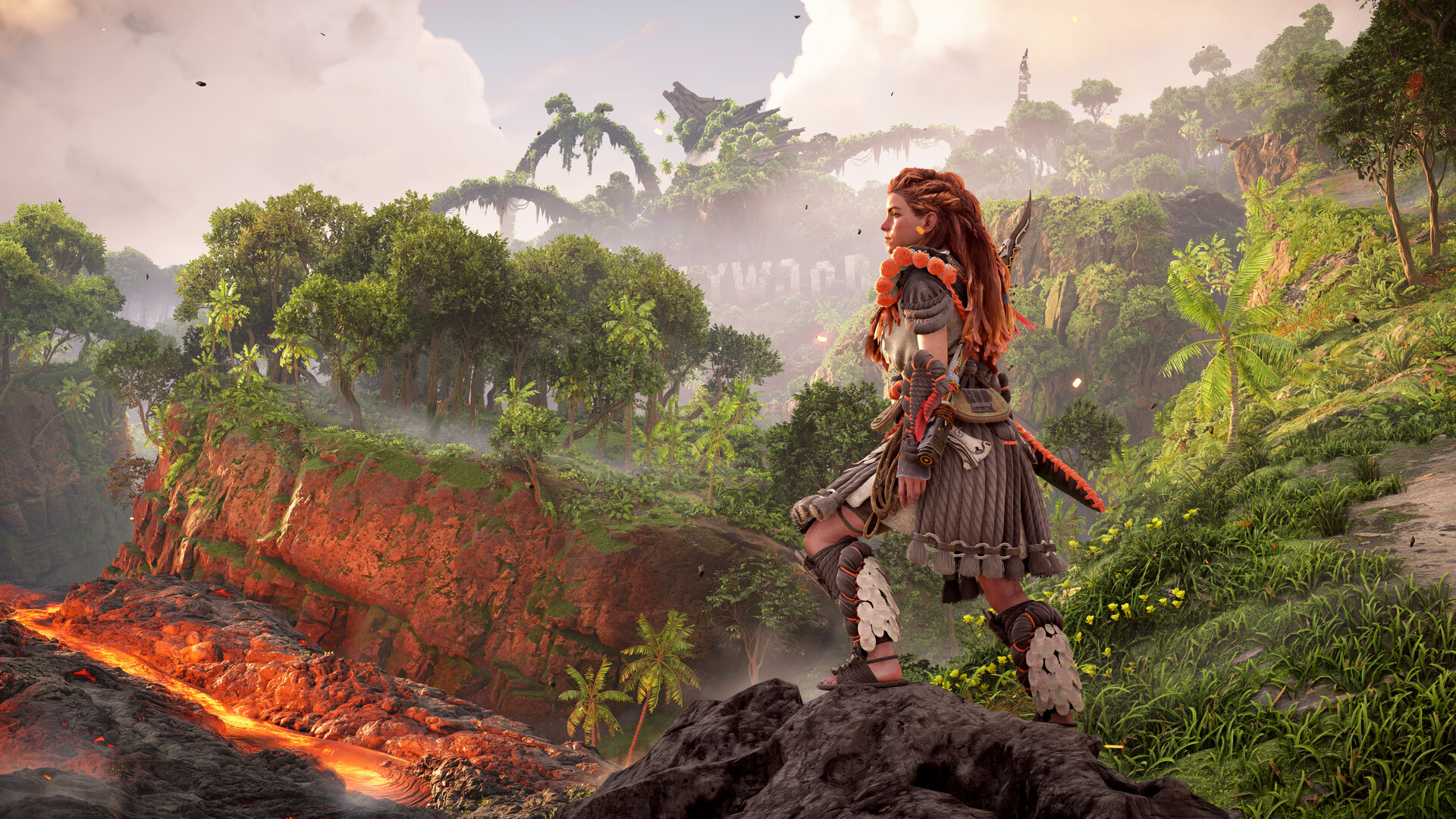 Aloy overlooks a green valley beside a lava flow.
