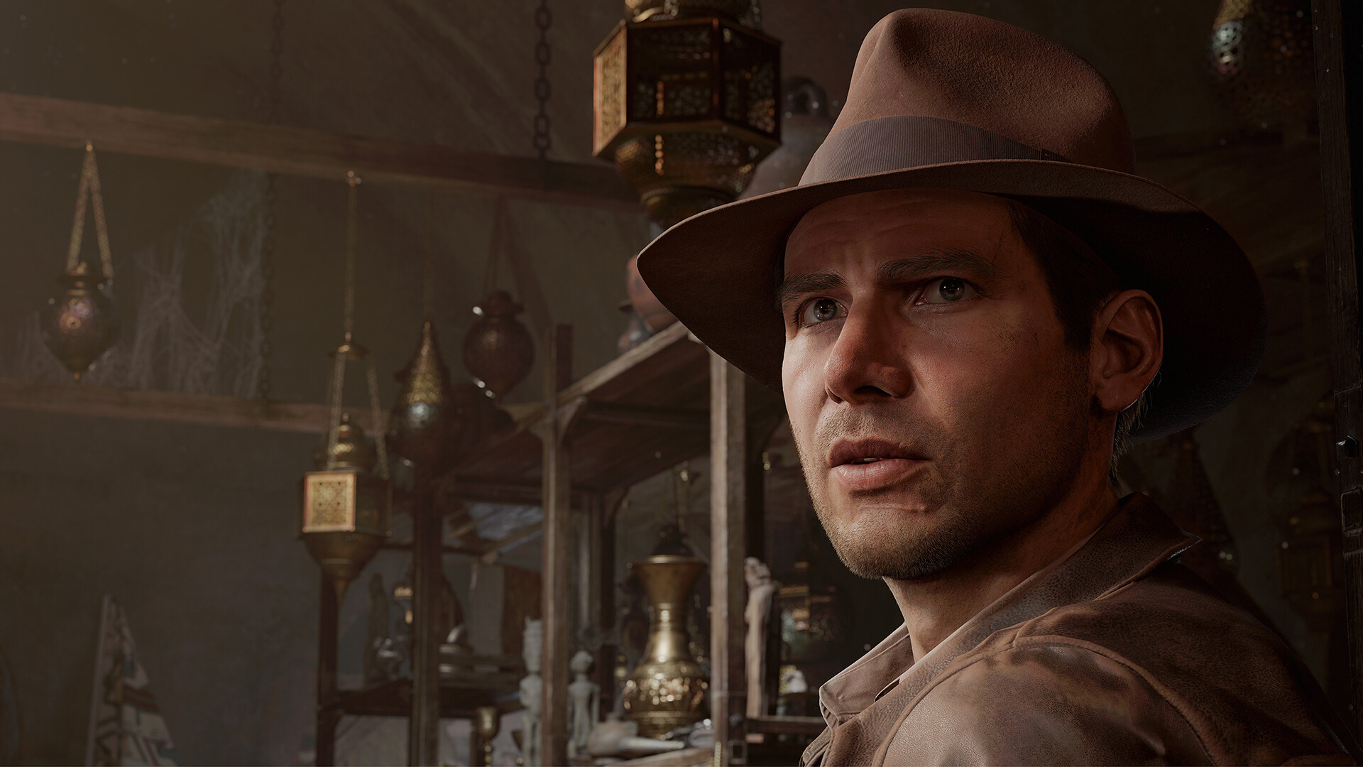 Indiana Jones stands inside a room lined with artifacts.