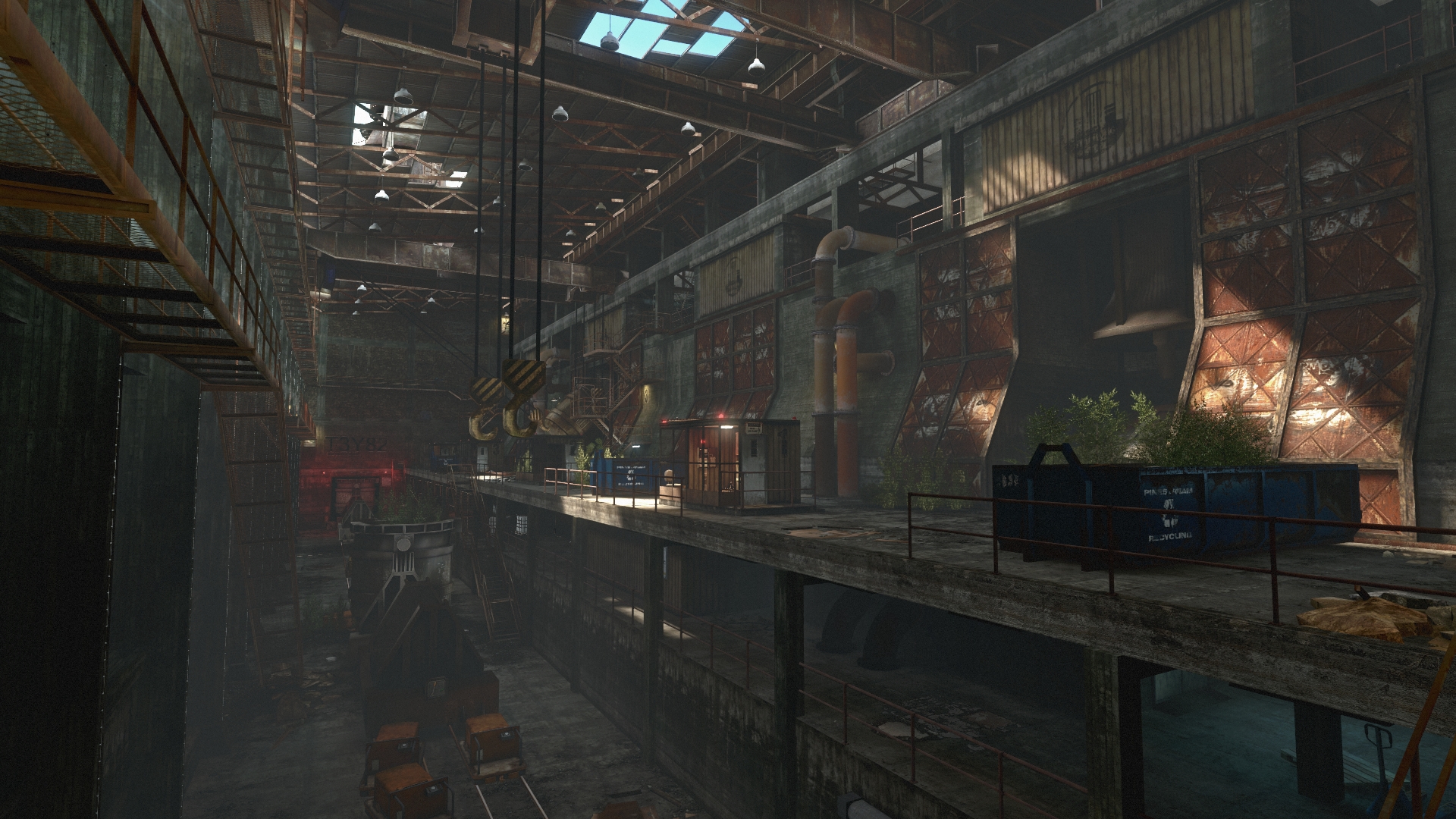 A walkway crosses a decaying industrial building.