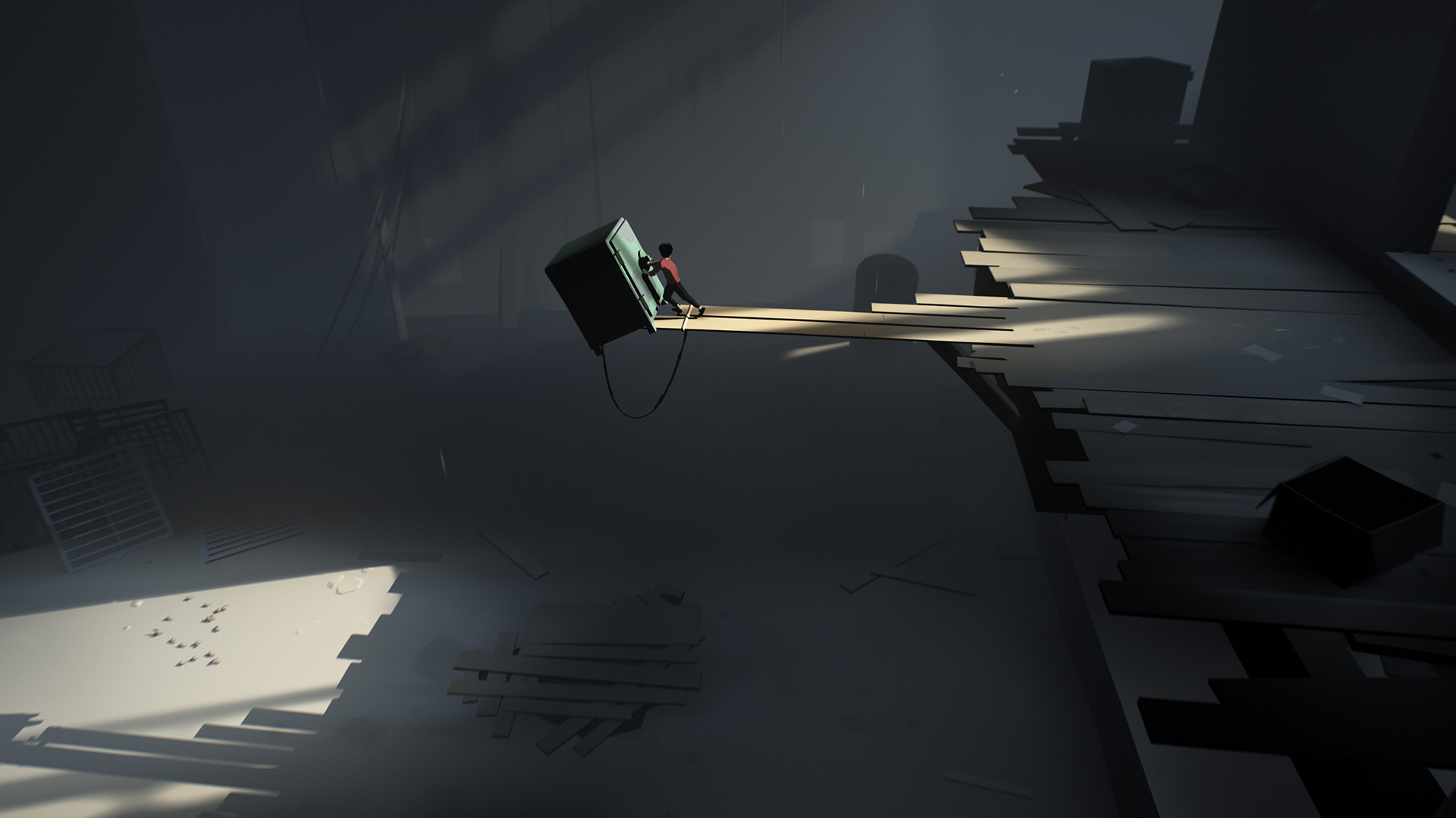 A boy reaches across a broken floor toward a glowing device.
