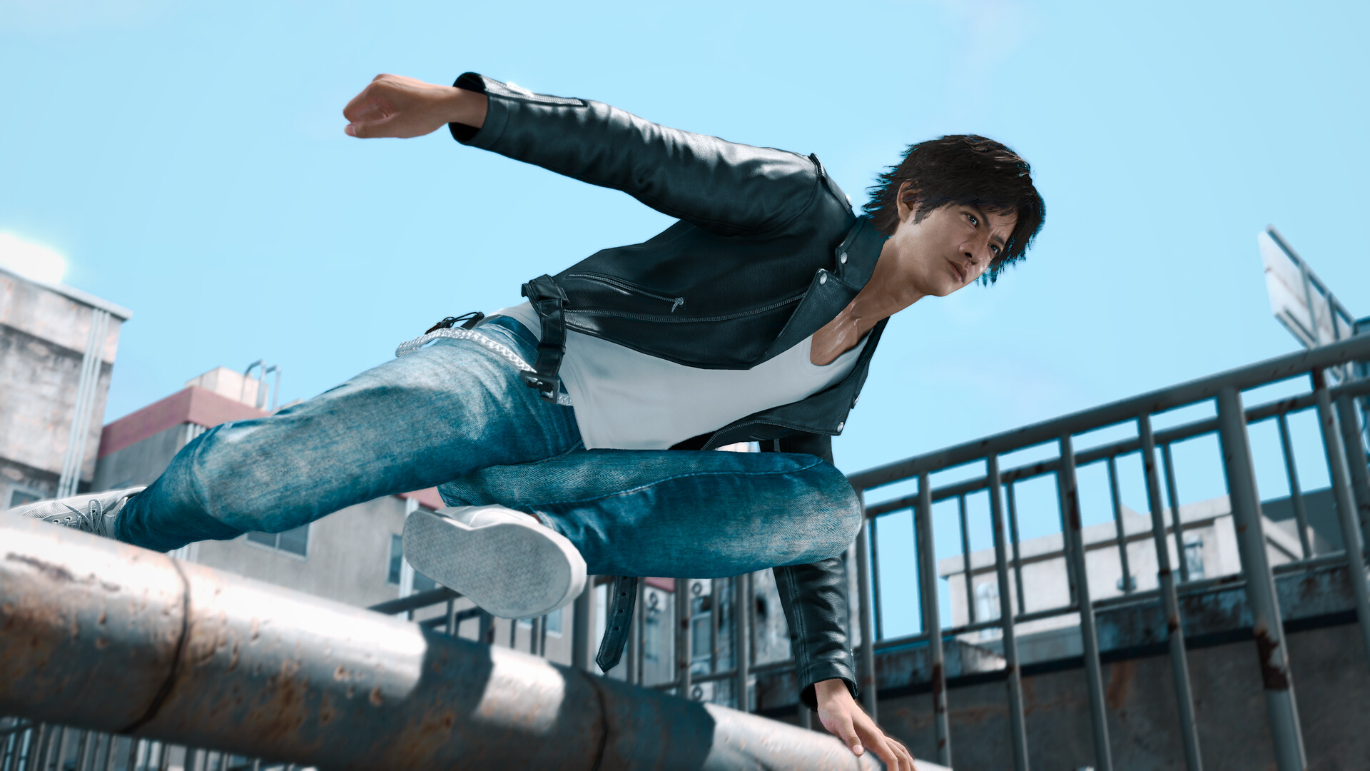Takayuki Yagami vaults over a railing.