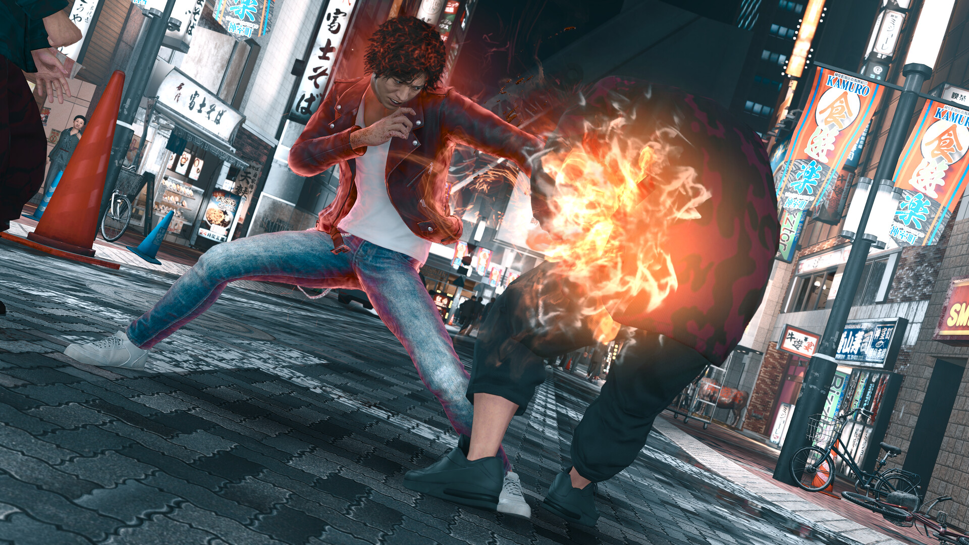 Yagami kicks an opponent during a street fight.