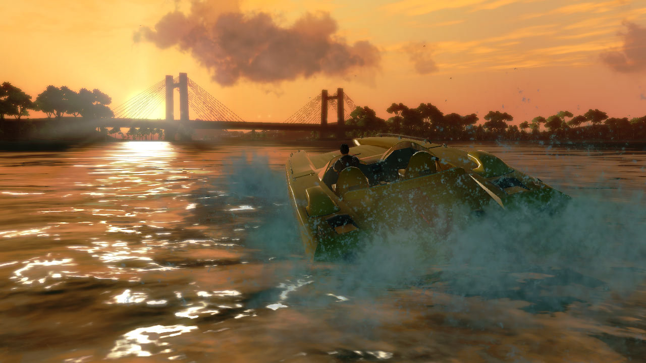 A vehicle crosses the water near a suspension bridge.