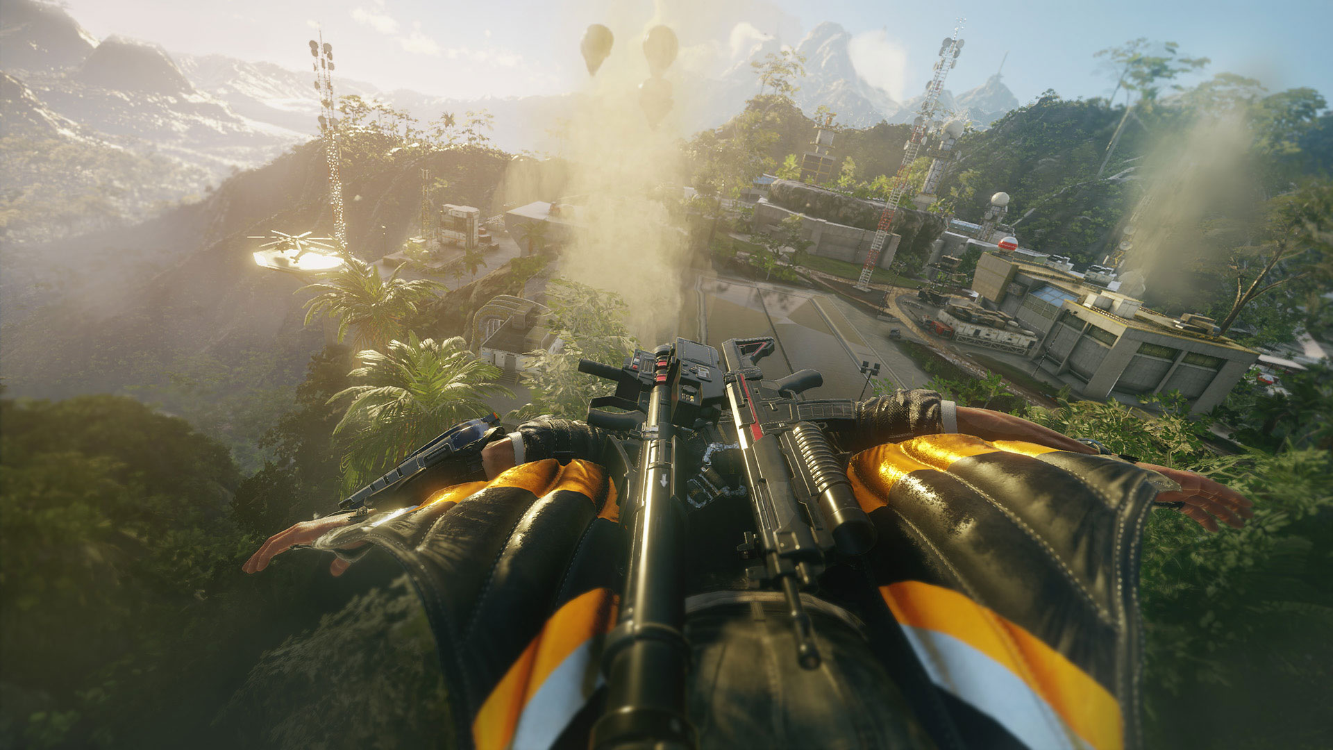 A wingsuit approach crosses a tropical military installation.