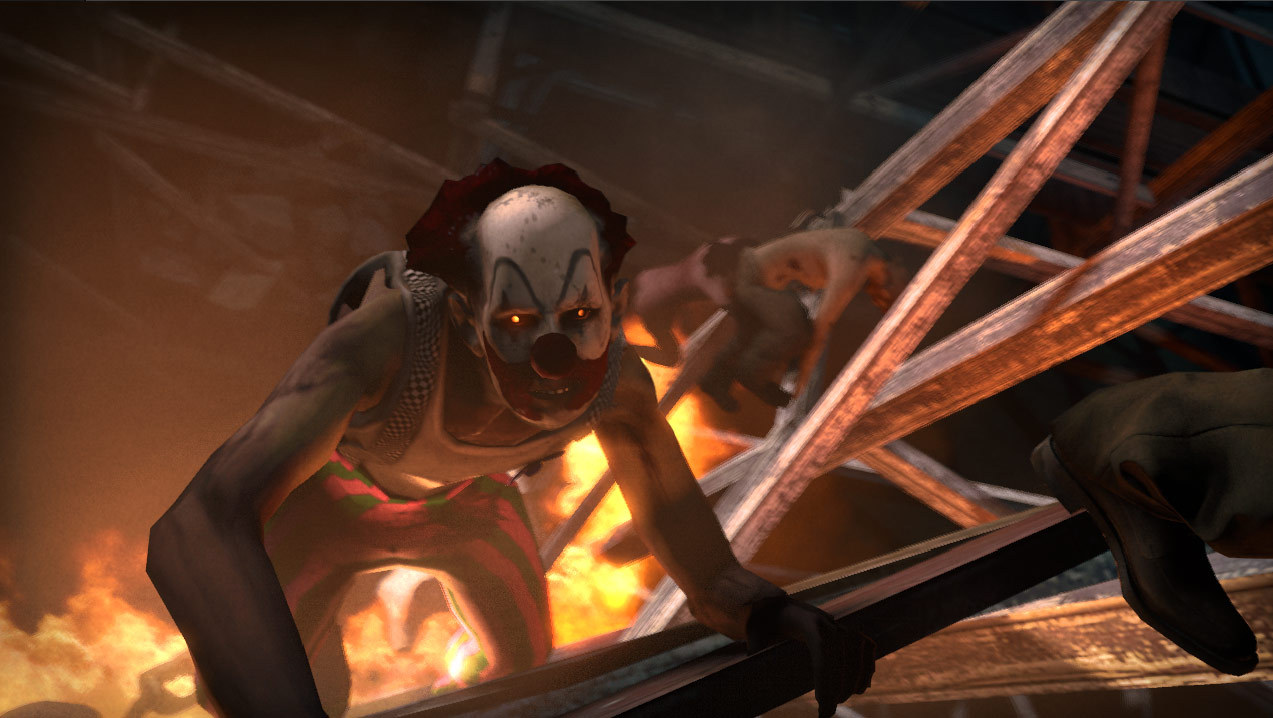 An infected creature crouches beside wreckage and flames.