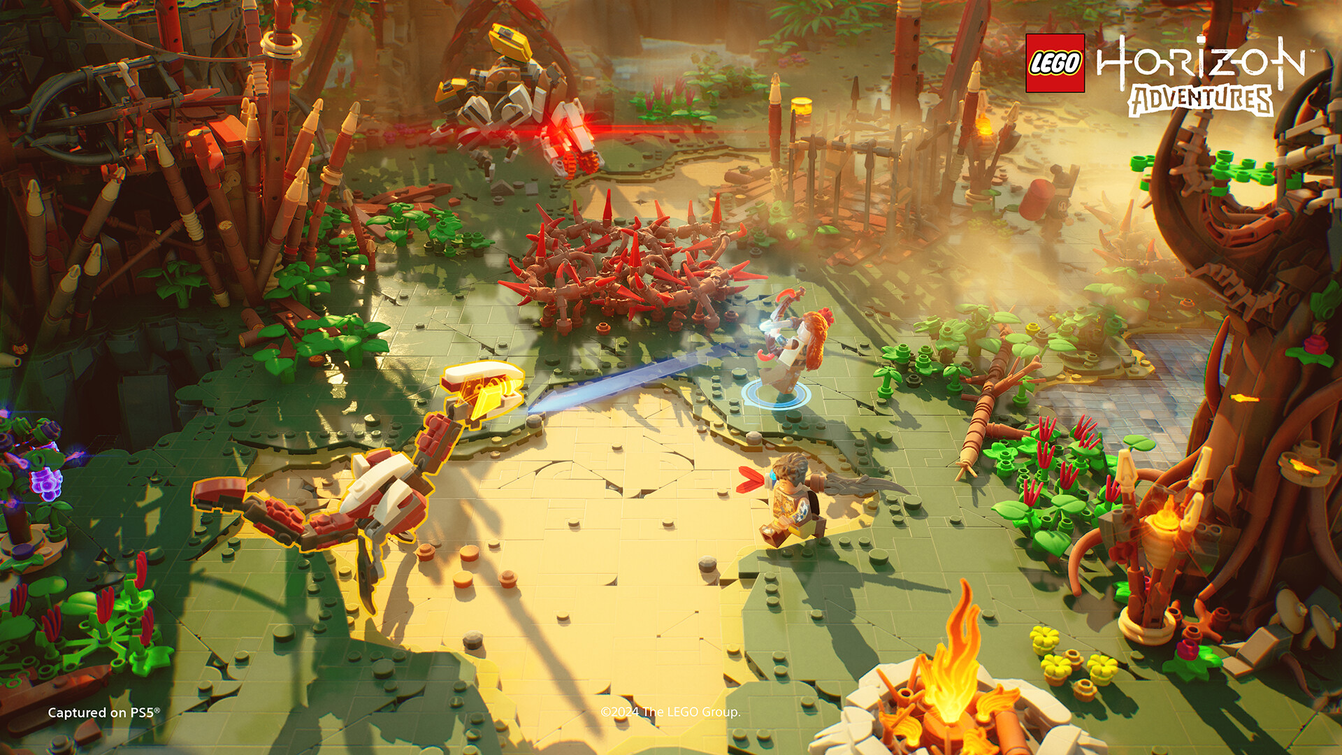 Aloy and a companion fight machine creatures in a LEGO-built clearing.