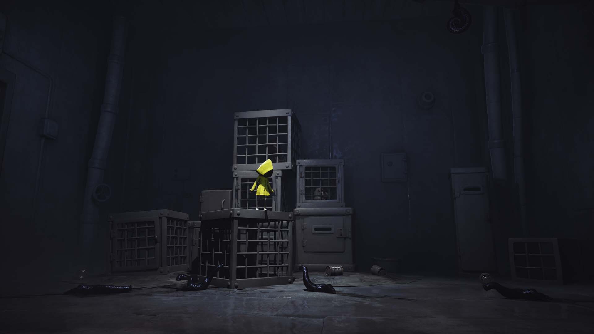 Six climbs over stacked cages in a dim room.