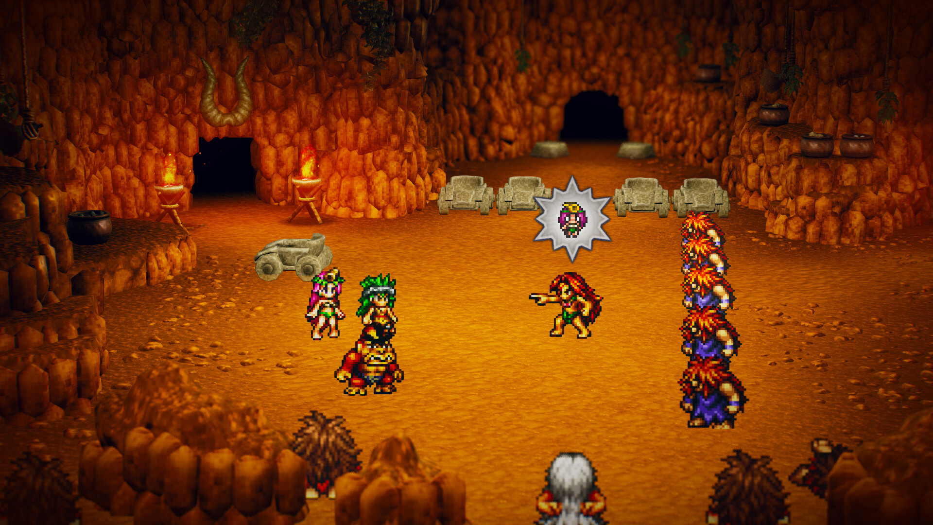 A party faces enemies inside a torchlit cave.