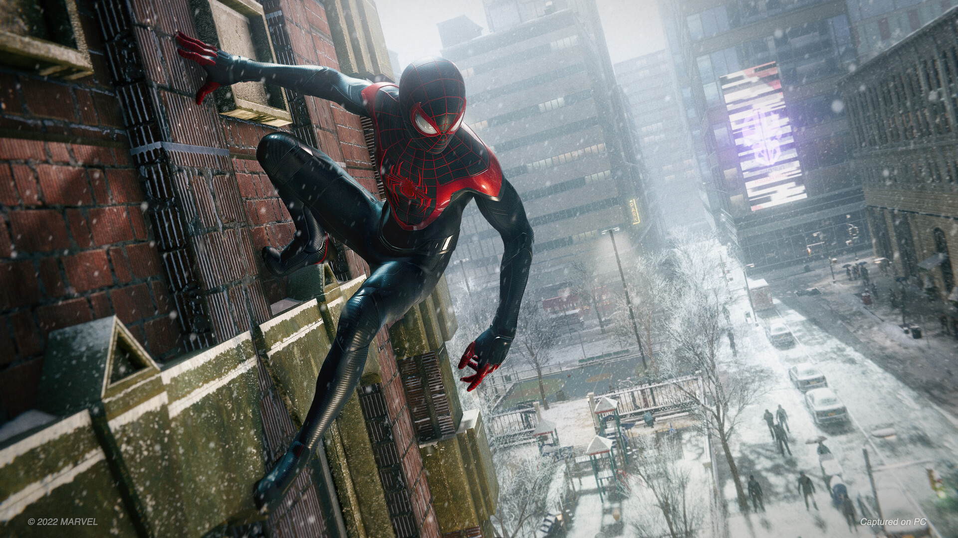 Miles moves along a building above a snowy New York street.