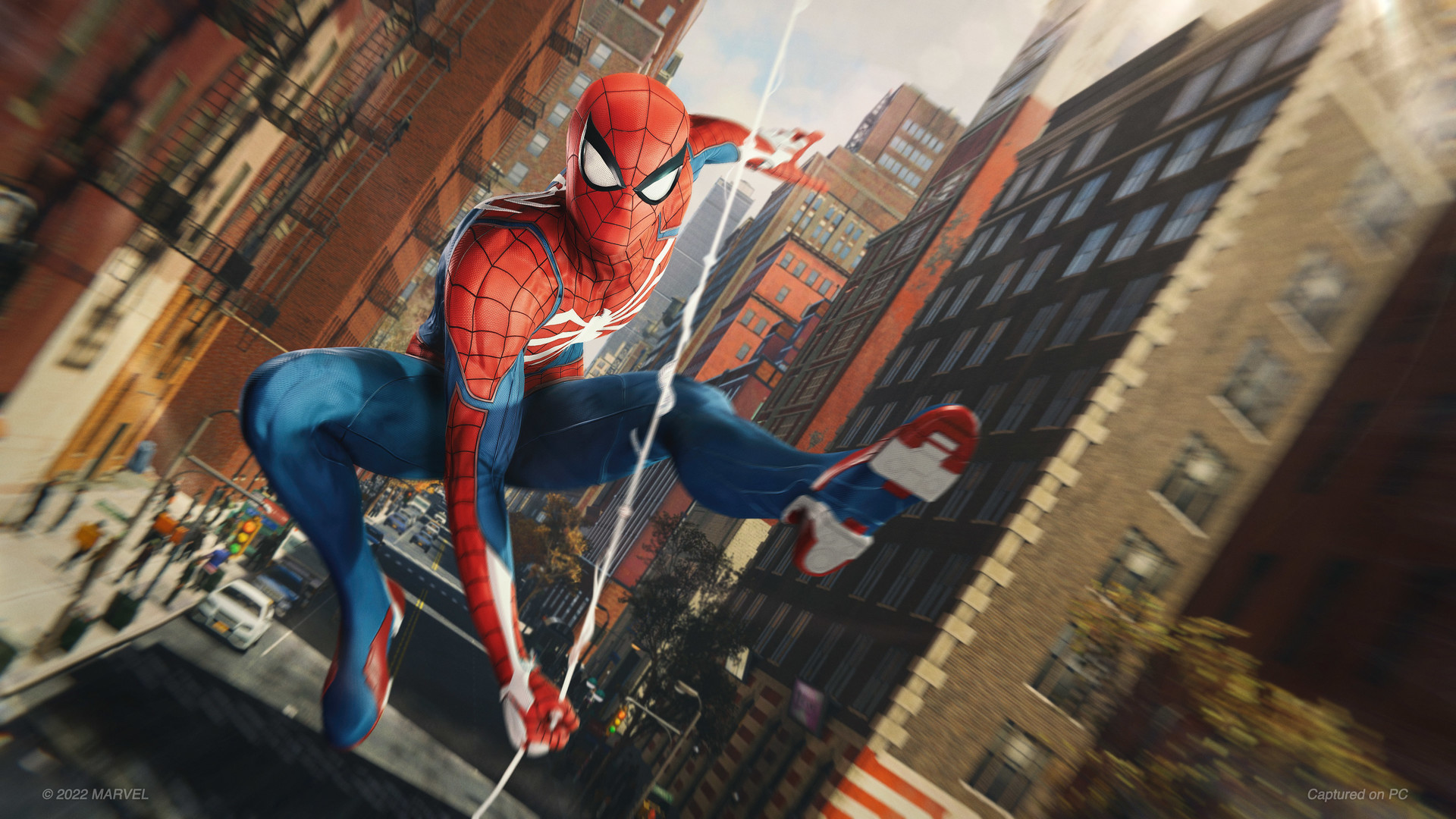Spider-Man swings between New York buildings.