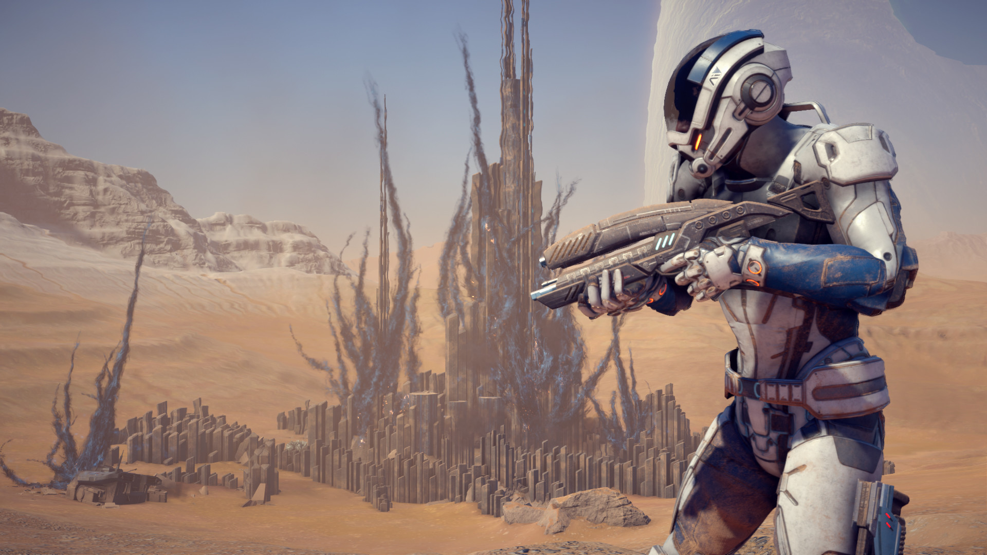 An armored explorer surveys a desert settlement.