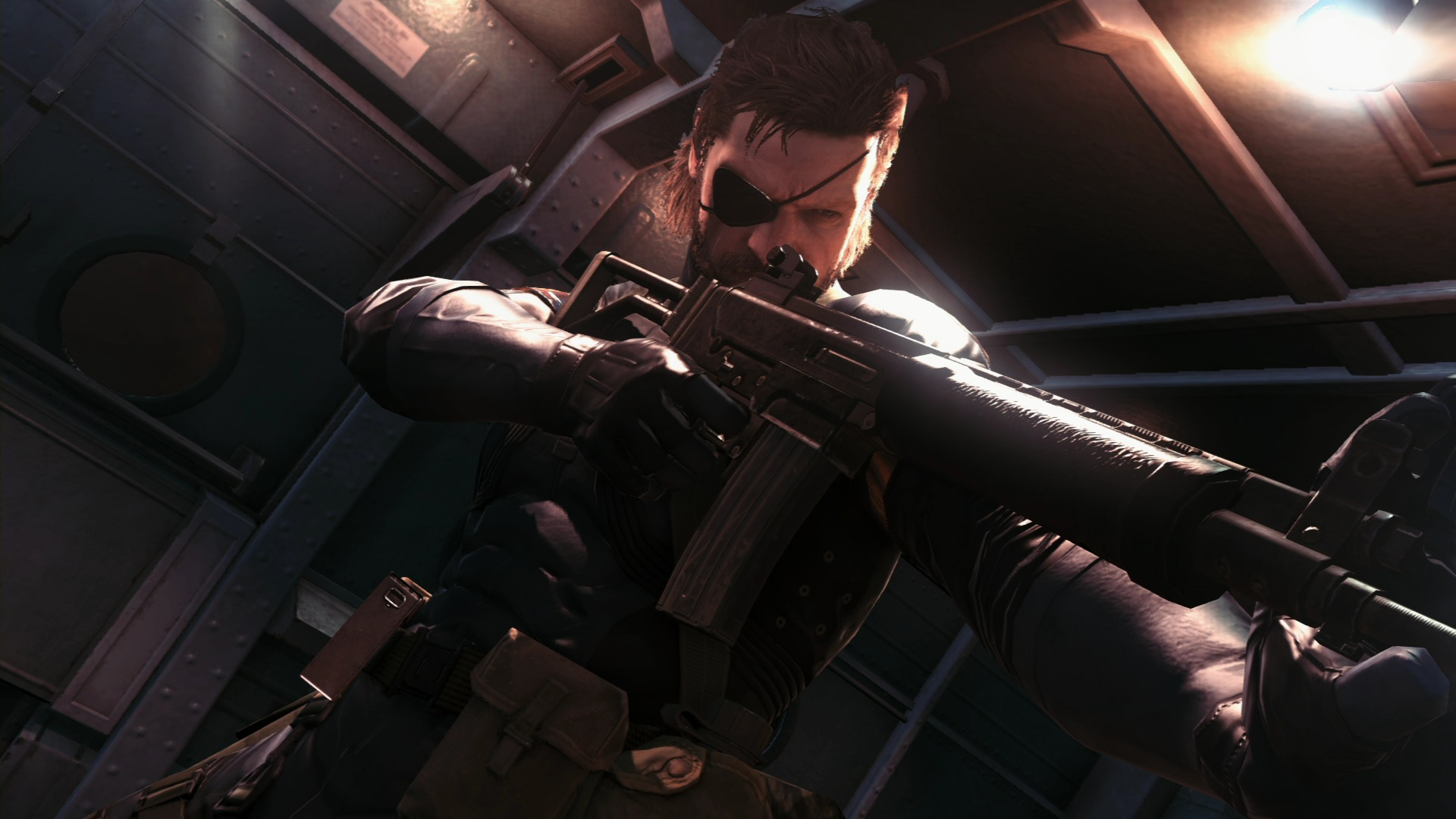 Snake prepares a rifle aboard an aircraft.