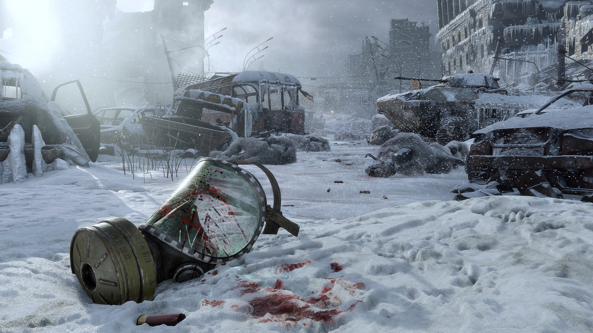 A gas mask lies in a snow-covered ruined street.