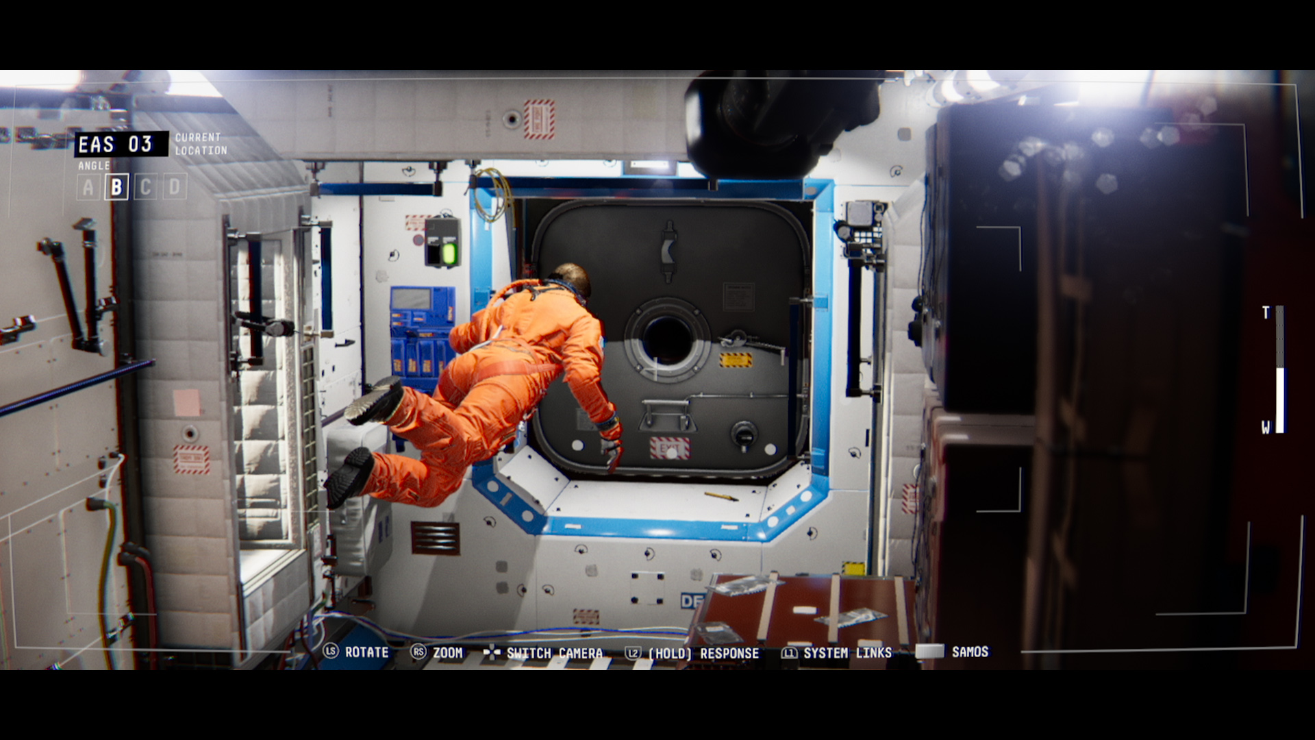 Emma Fisher floats through a module of the damaged space station.