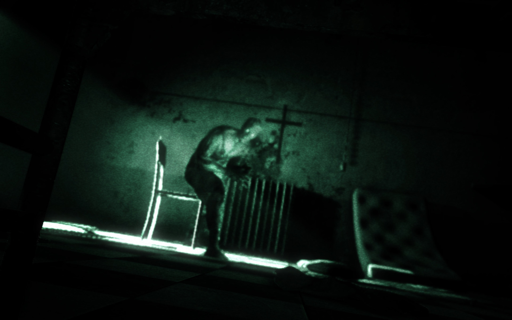 A hunched figure appears in night-vision footage.